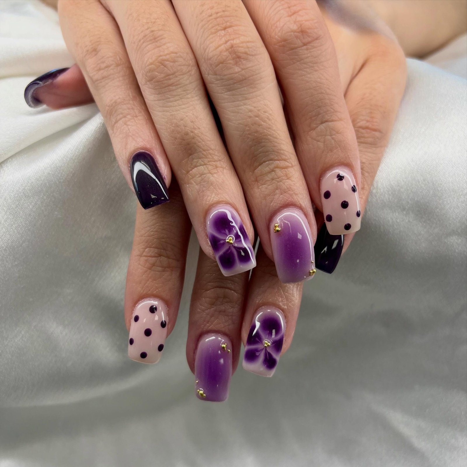 Purple Floral Nails with Nude Polka-Dot Accents