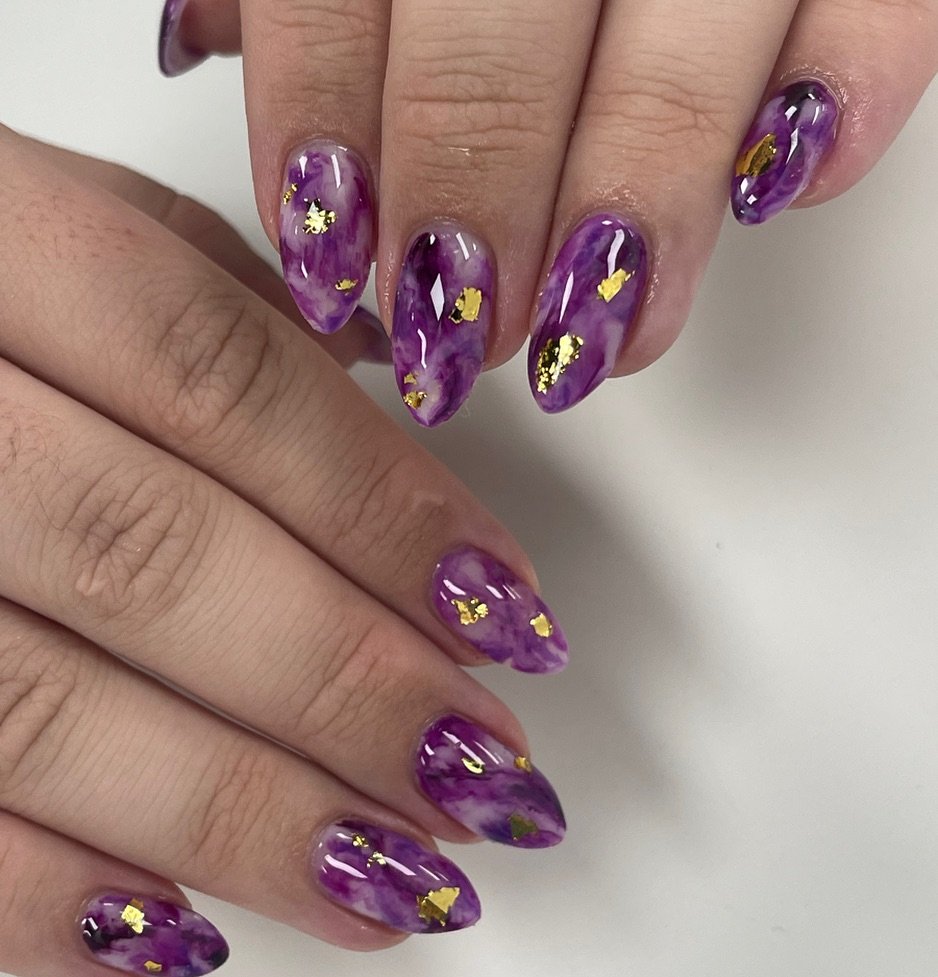 Translucent Purple Almond Nails with Gold Flecks
