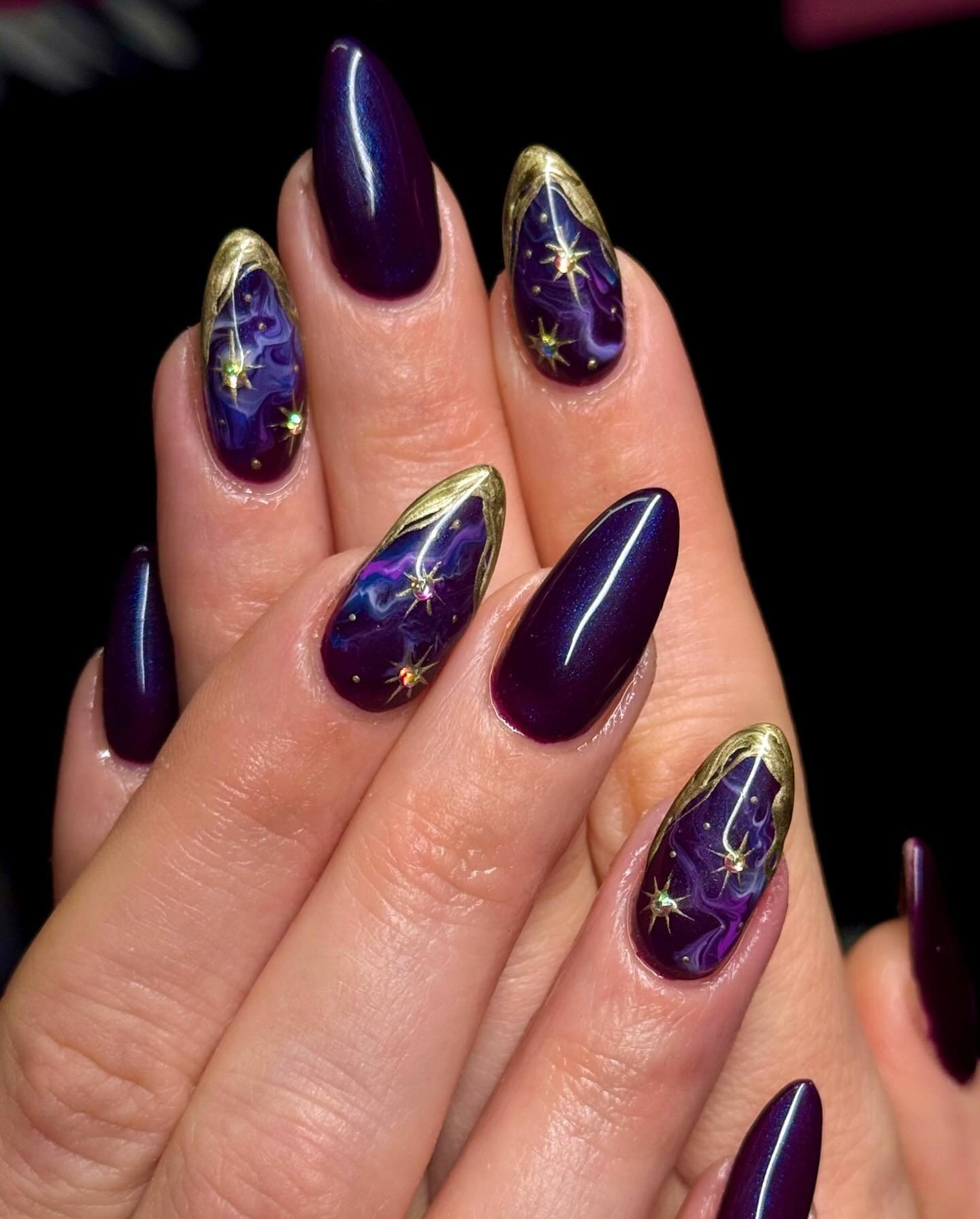 Purple Almond Nails with Gold Star Accents