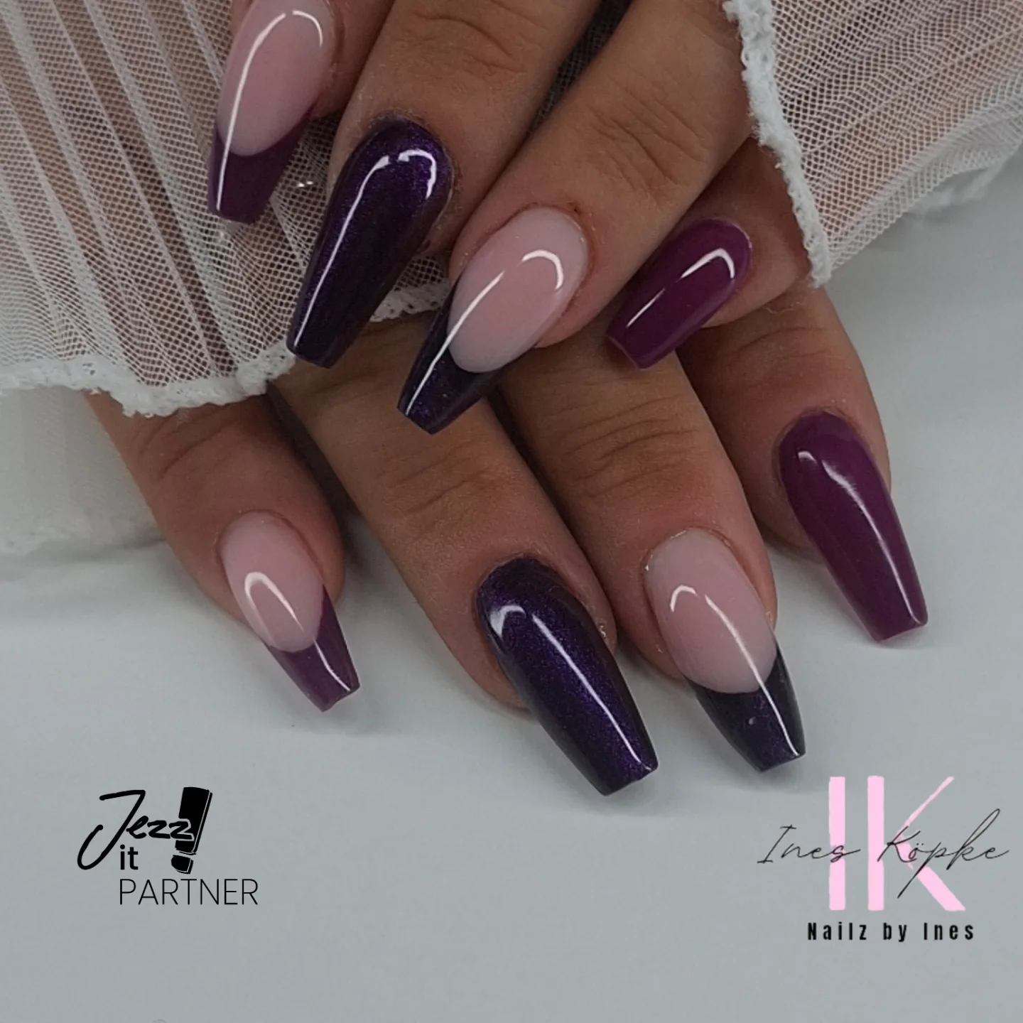 Deep Purple and Nude Nails with Curved White Accents