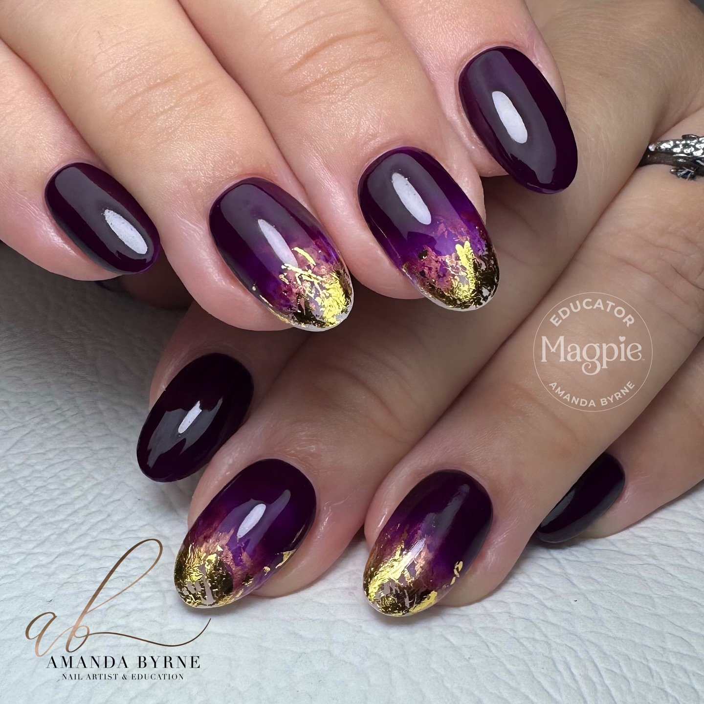 Glossy Plum Nails with Gold Glitter Tips