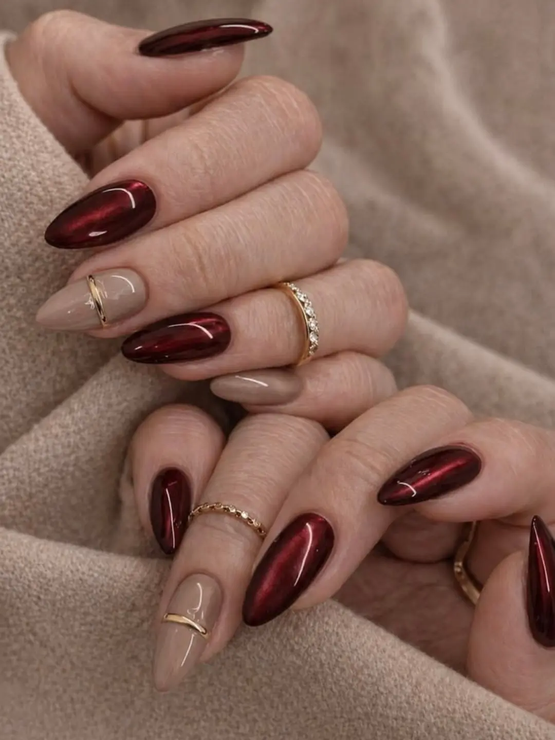 Burgundy and nude almond nails