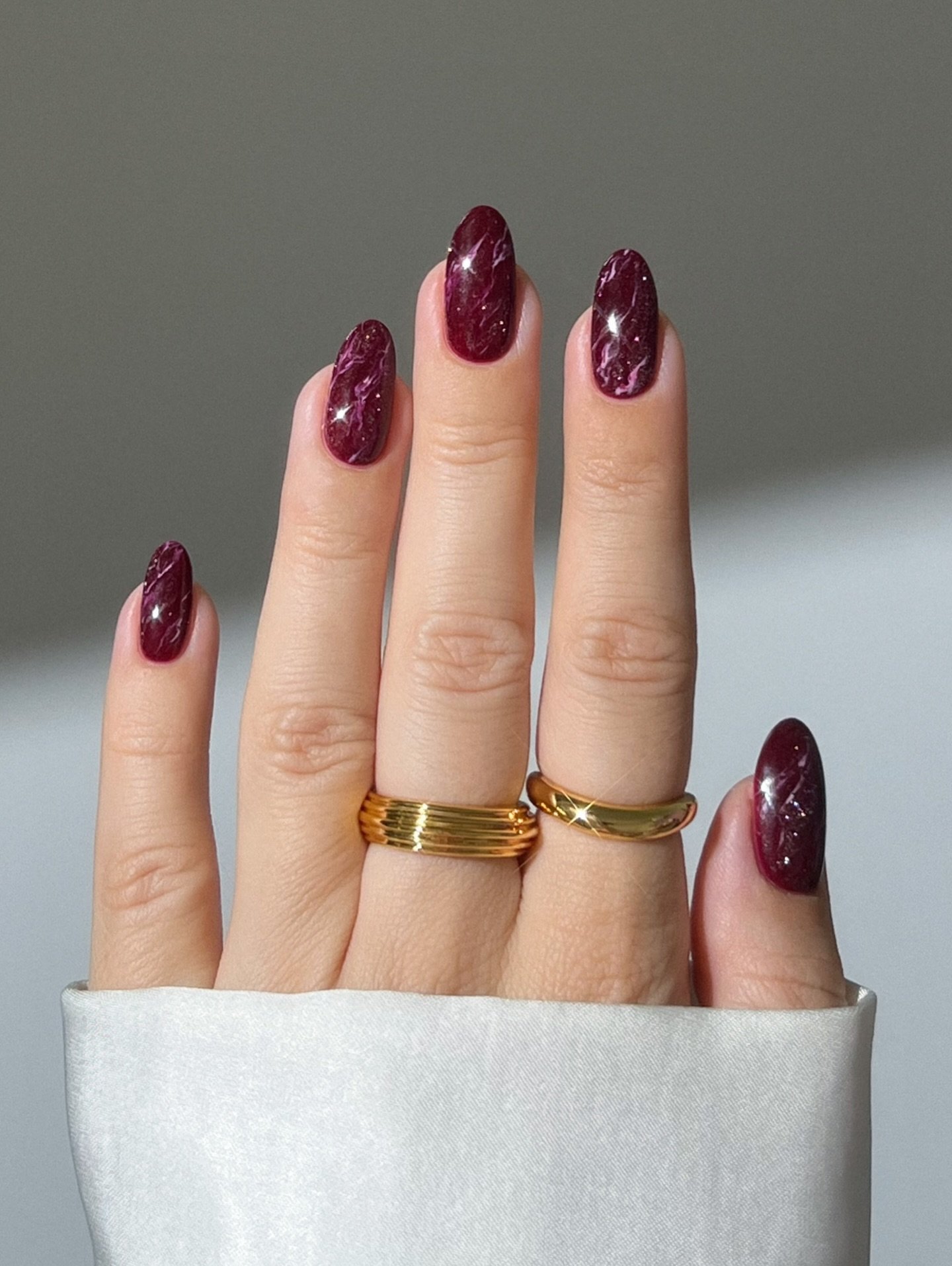 Short glossy burgundy oval nails