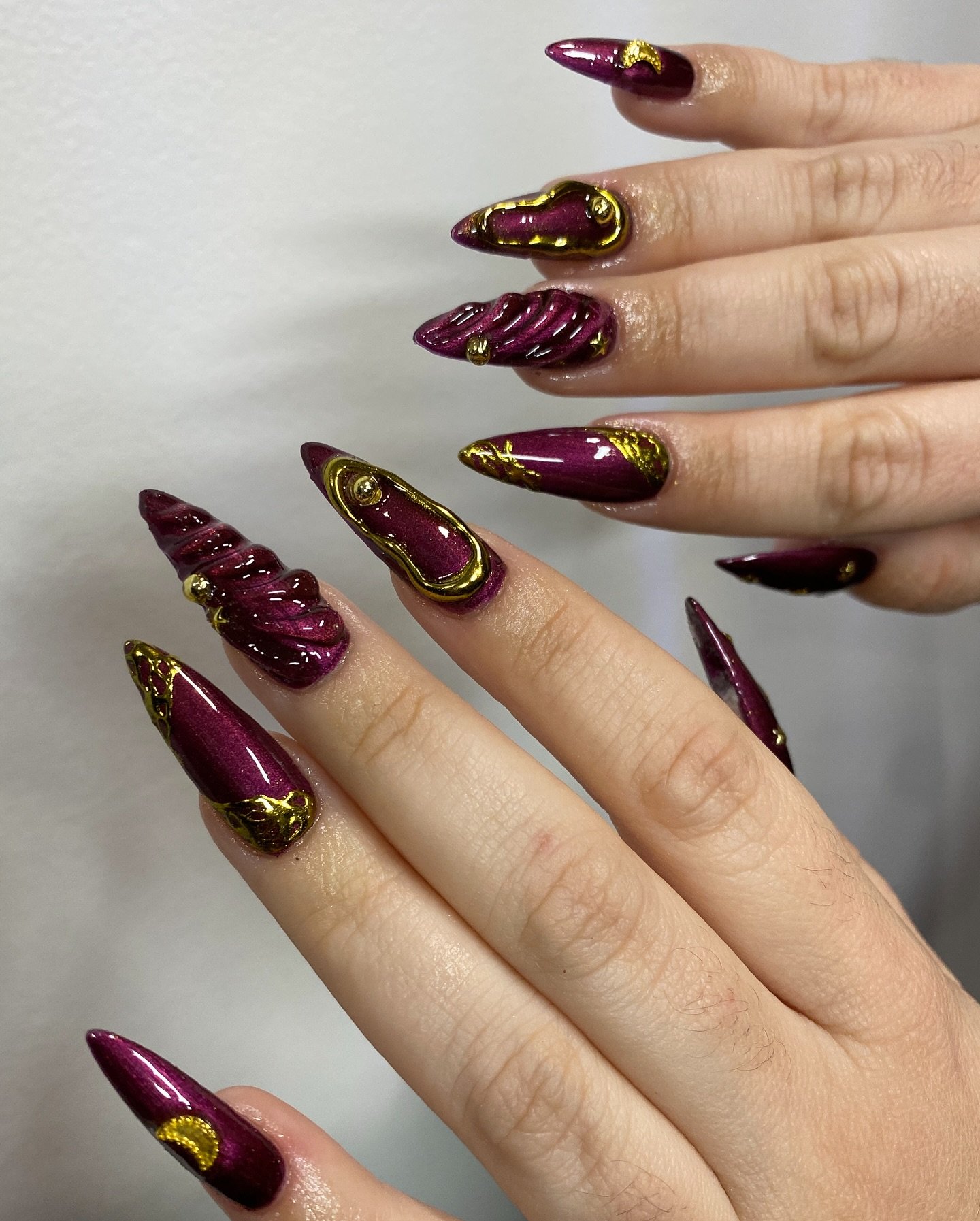 Deep Wine Stiletto Nails with Gold Details