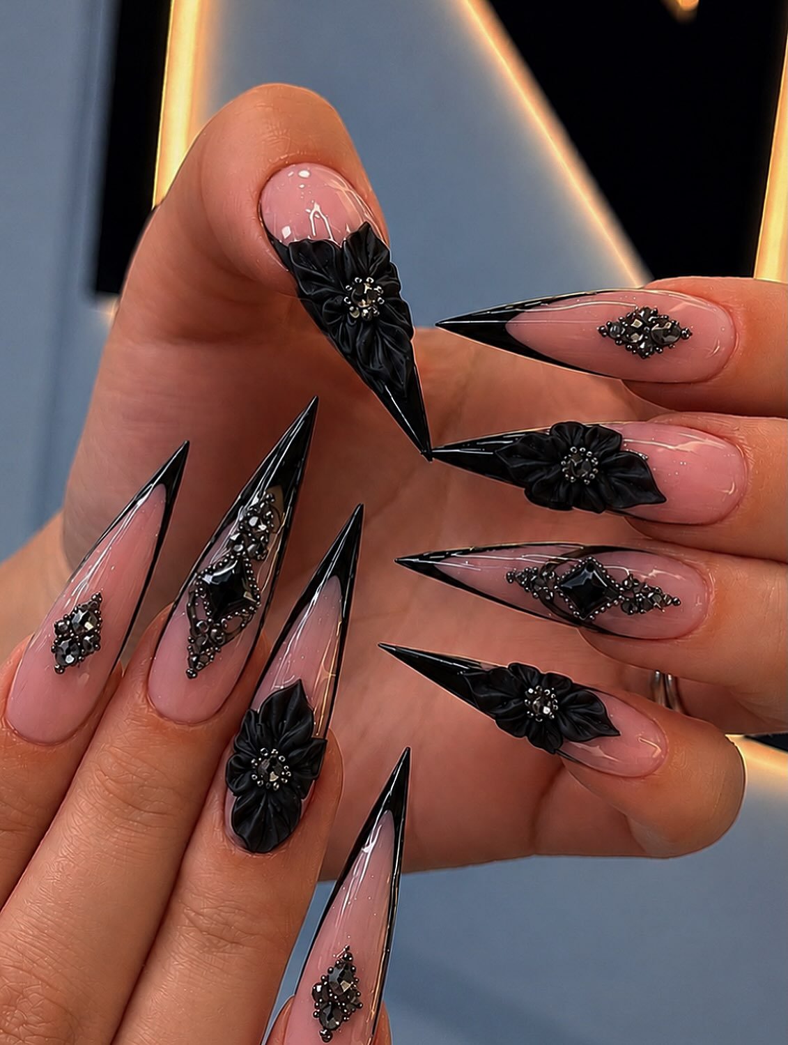 Black Textured Stiletto Nails with Ornamental Accents