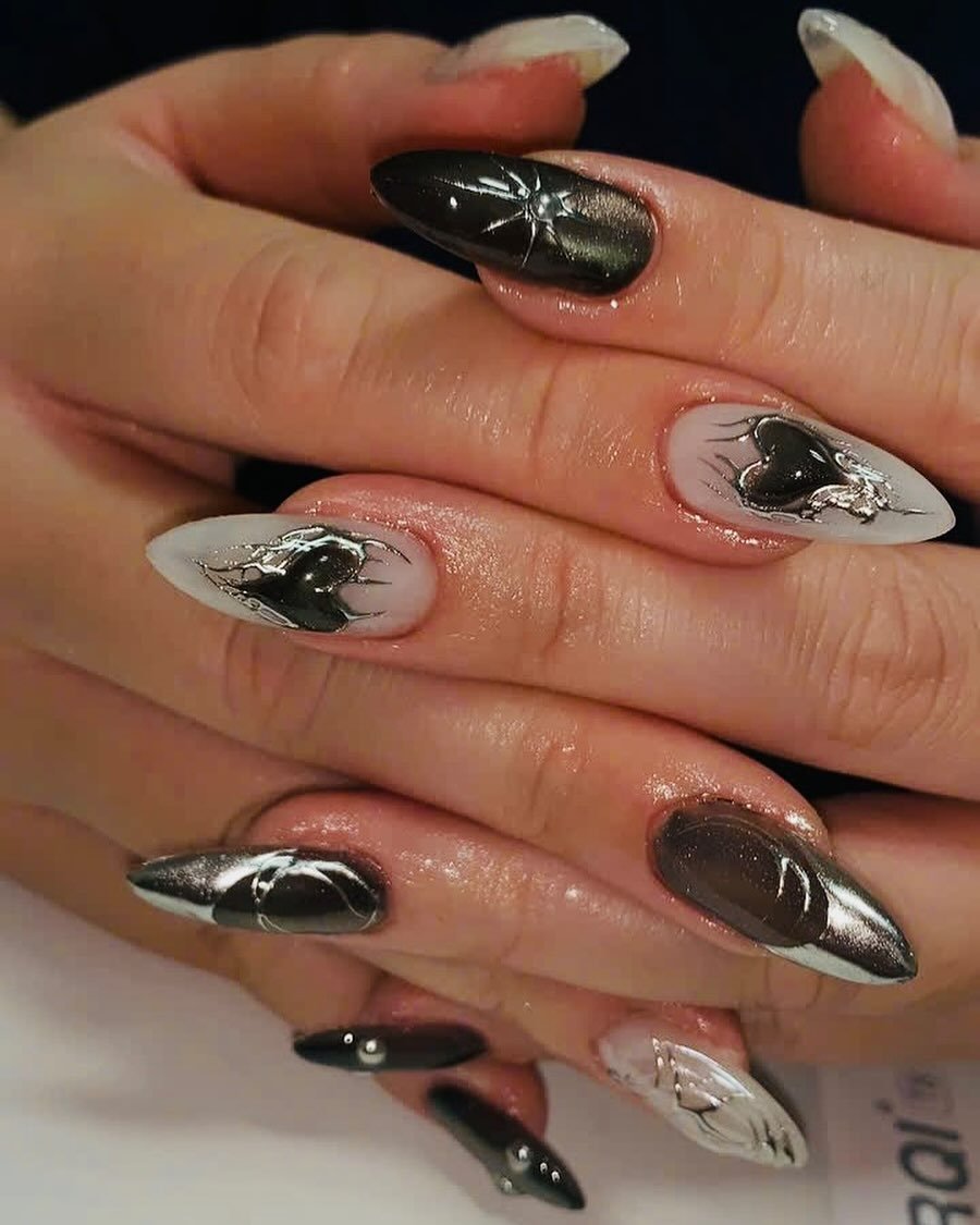 Nude Almond Nails with Black and Silver Accents