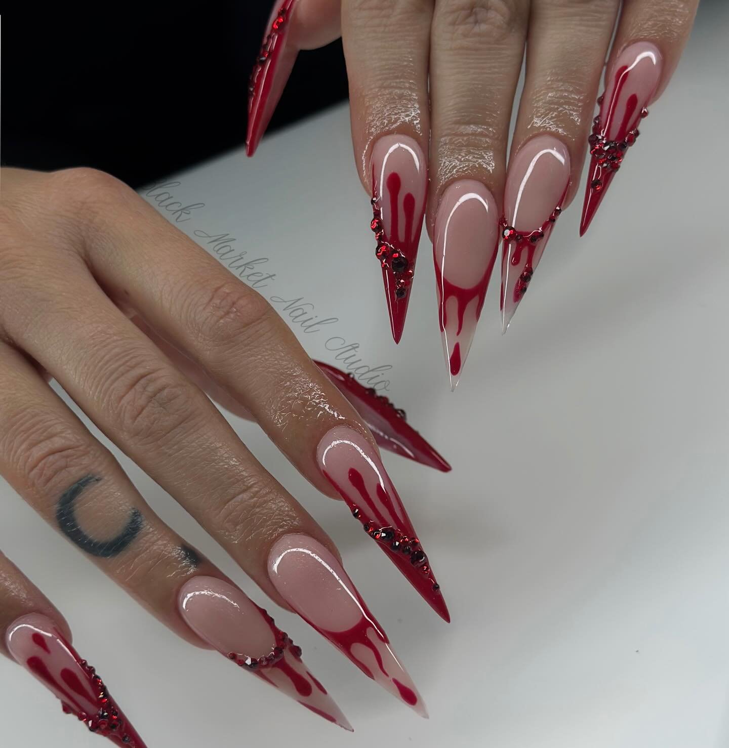 Long Nude Stiletto Nails with Red Linear Details