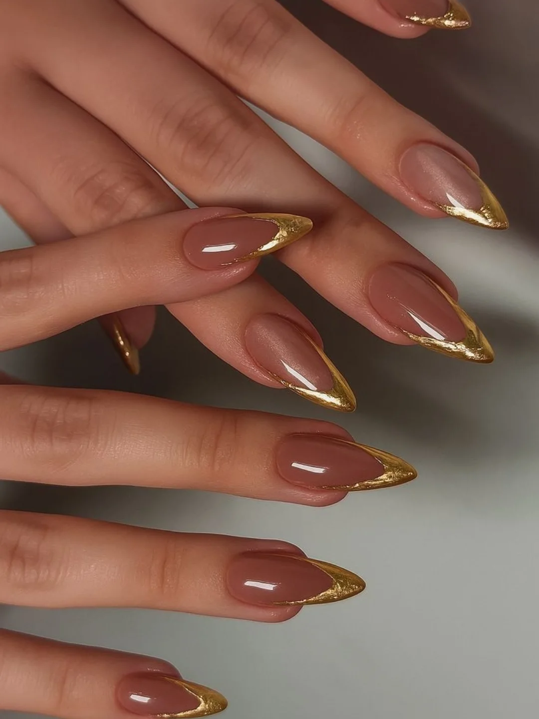 Warm Nude Almond Nails with Brown-Gold Tips
