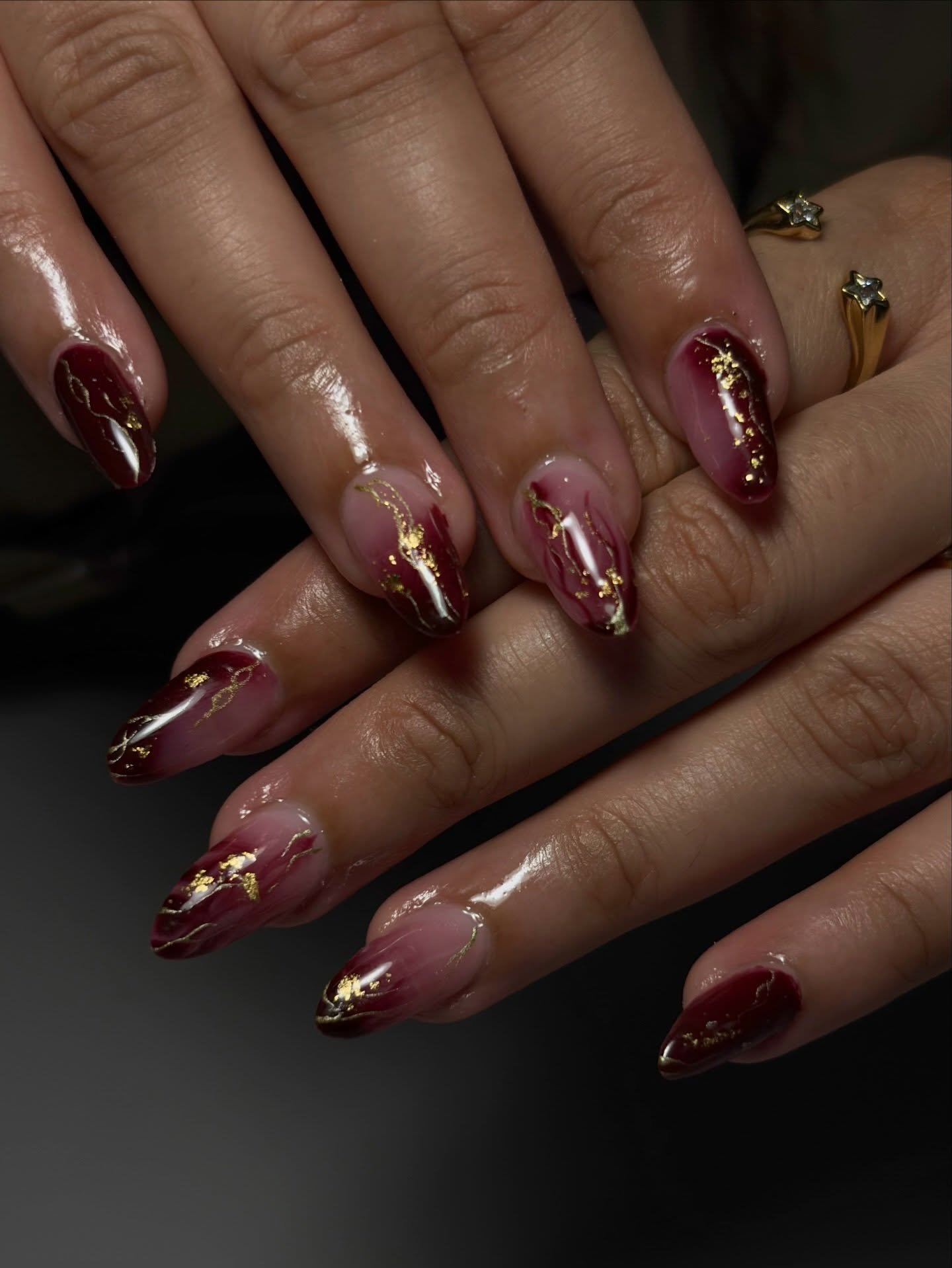 Deep Wine Almond Nails with Gold Accents
