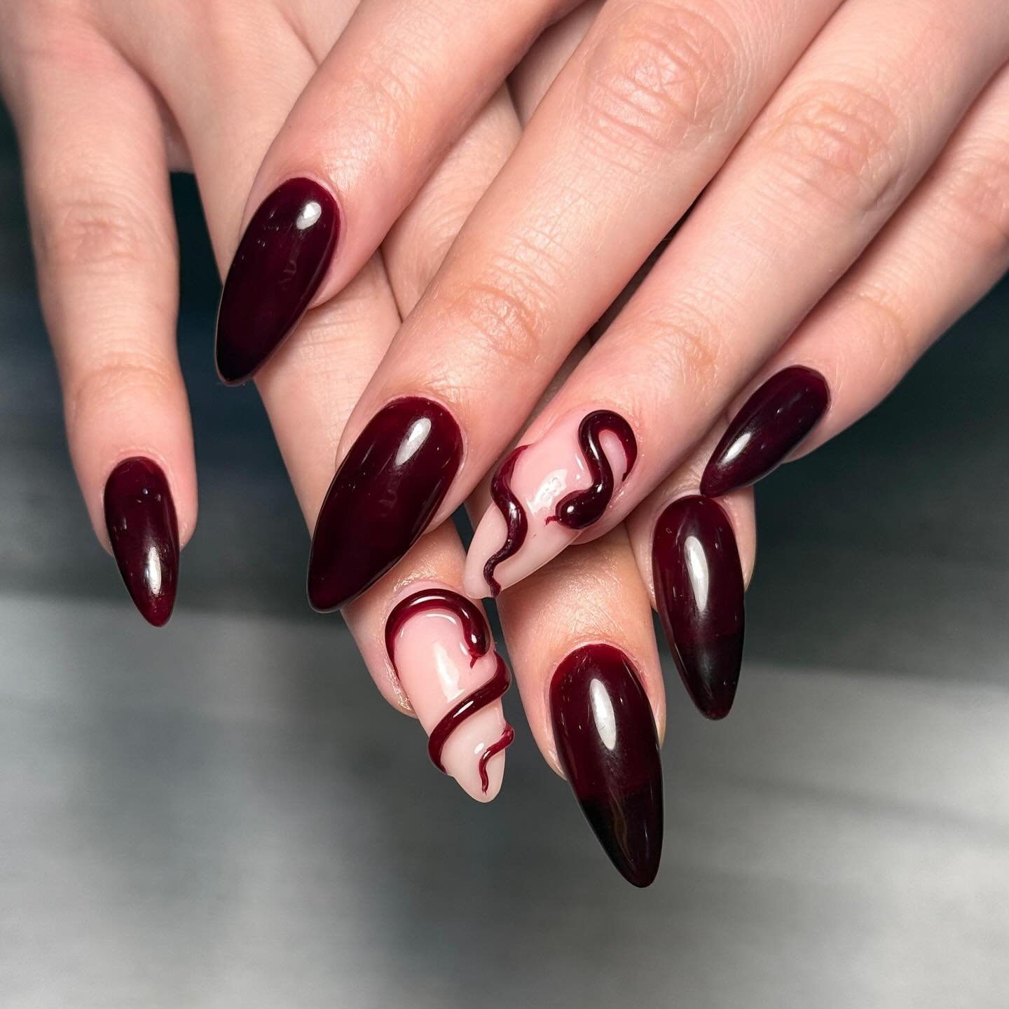 Deep Burgundy Nails with Curved Nude Lines