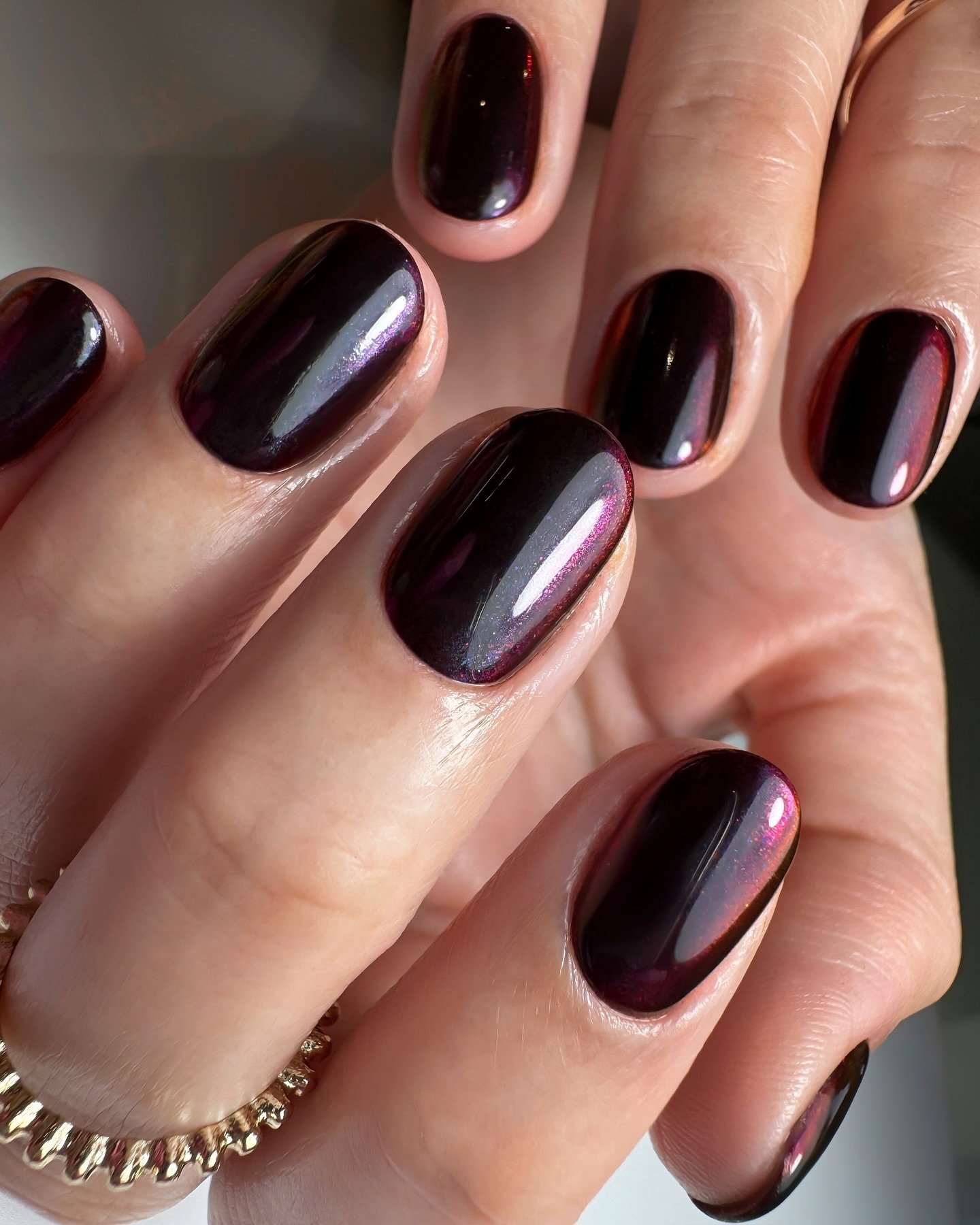 Deep Brown Short Oval Nails with Purple Highlights