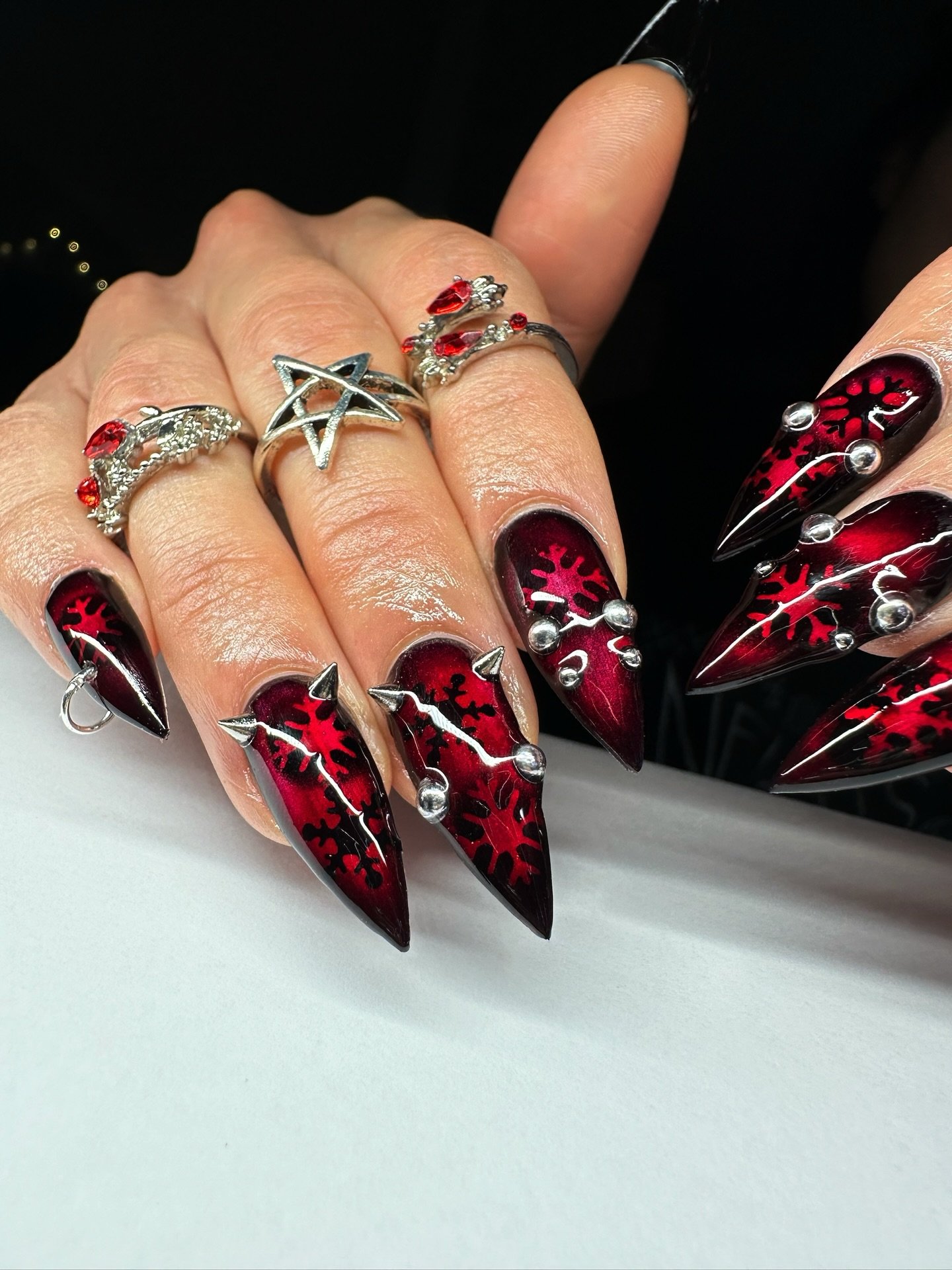 Black and Red Stiletto Nails with Graphic Details