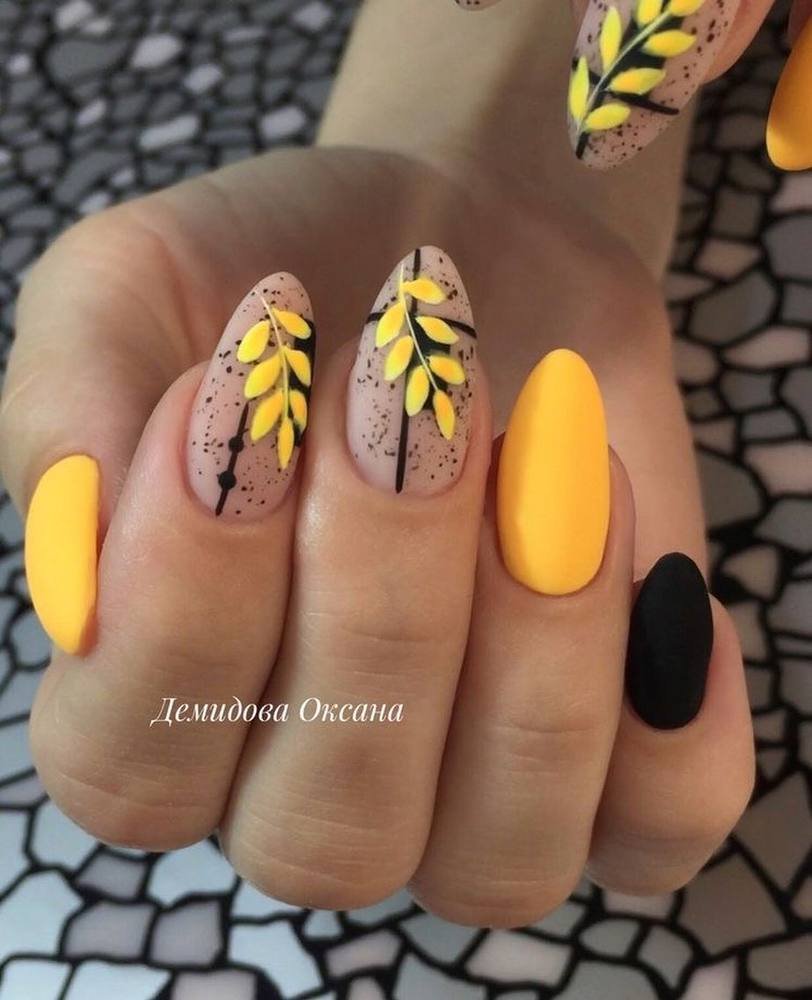 Yellow Almond Nails with Black Leaf-Like Line Art