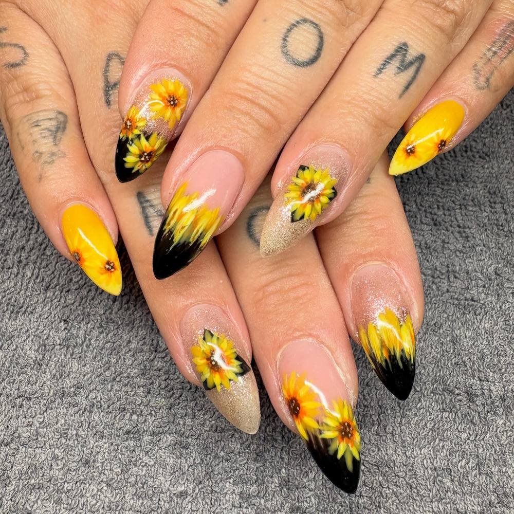 Yellow Stiletto Nails with Floral and Black Feather-Like Details