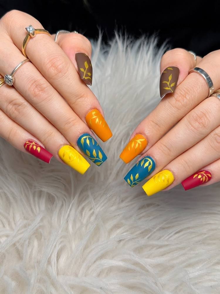 Colorful Yellow Nails with Blue, Orange, and Green Accents