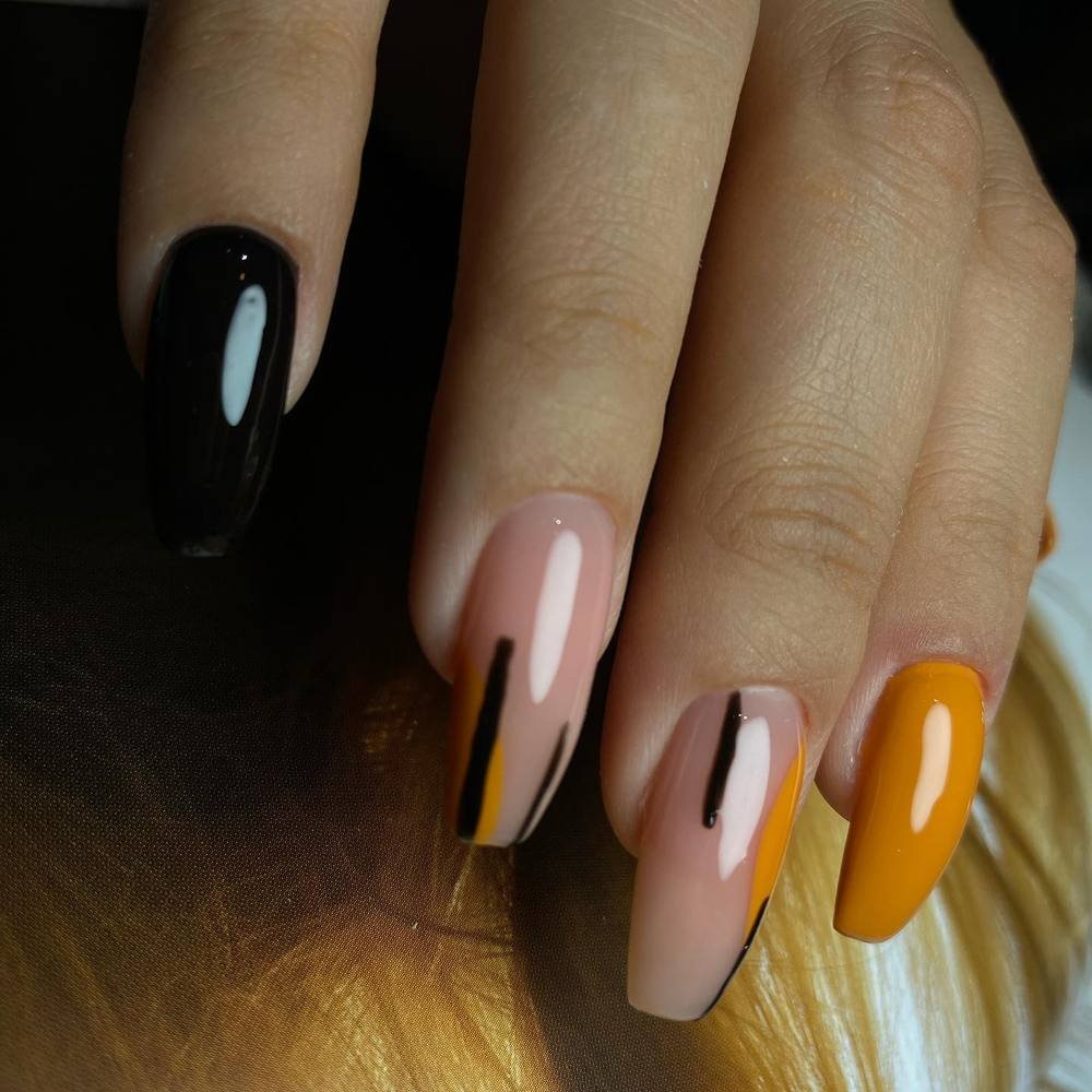 Black, Nude, and Yellow Mixed Almond Nails