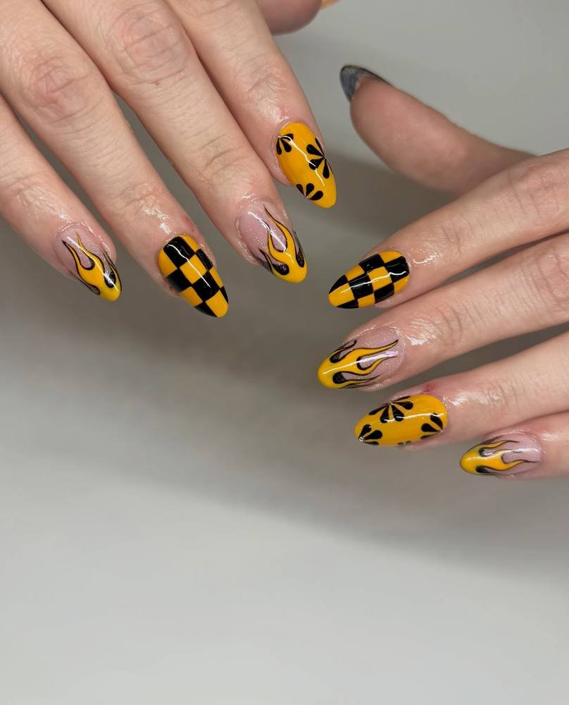 Yellow and Black Nails with Small Floral Details