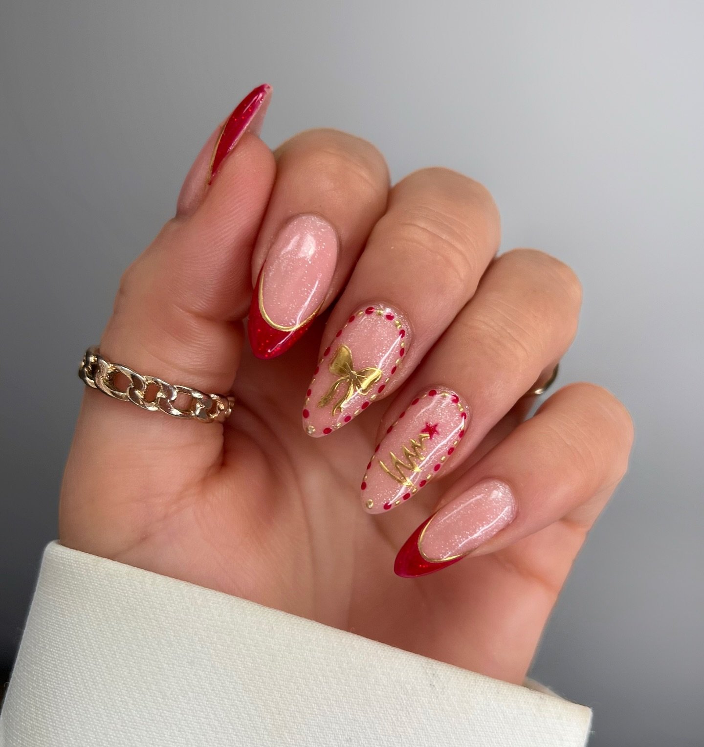 Soft Pink Almond Nails with Delicate Holiday Accents