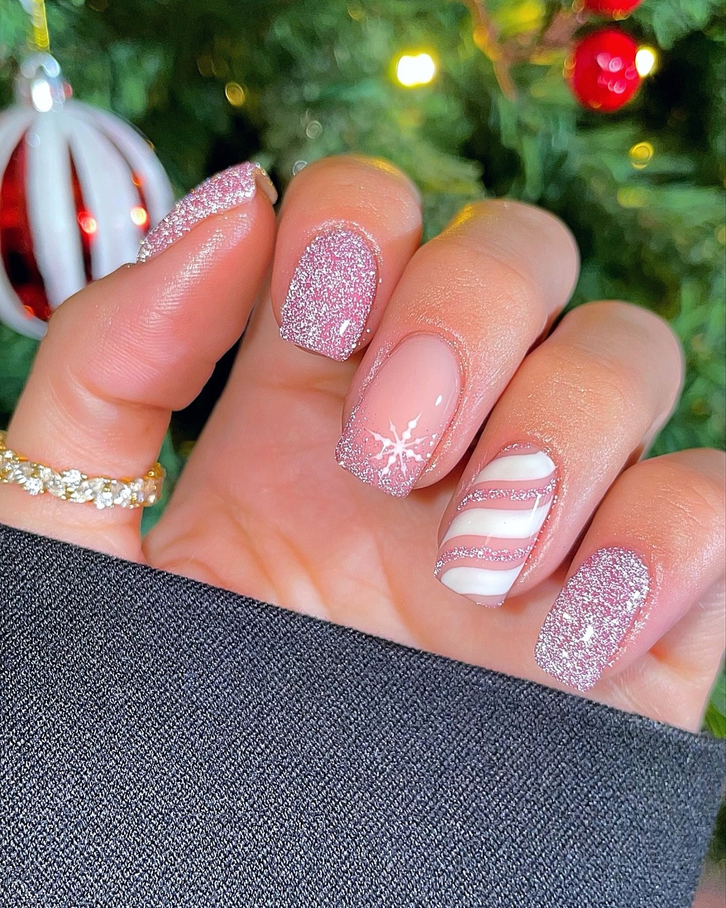Soft Pink Glitter Nails with a Red-and-White Stripe
