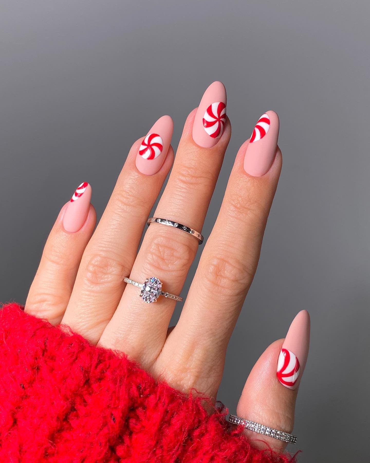 Soft Pink Nails with Bright Red Curved Tips