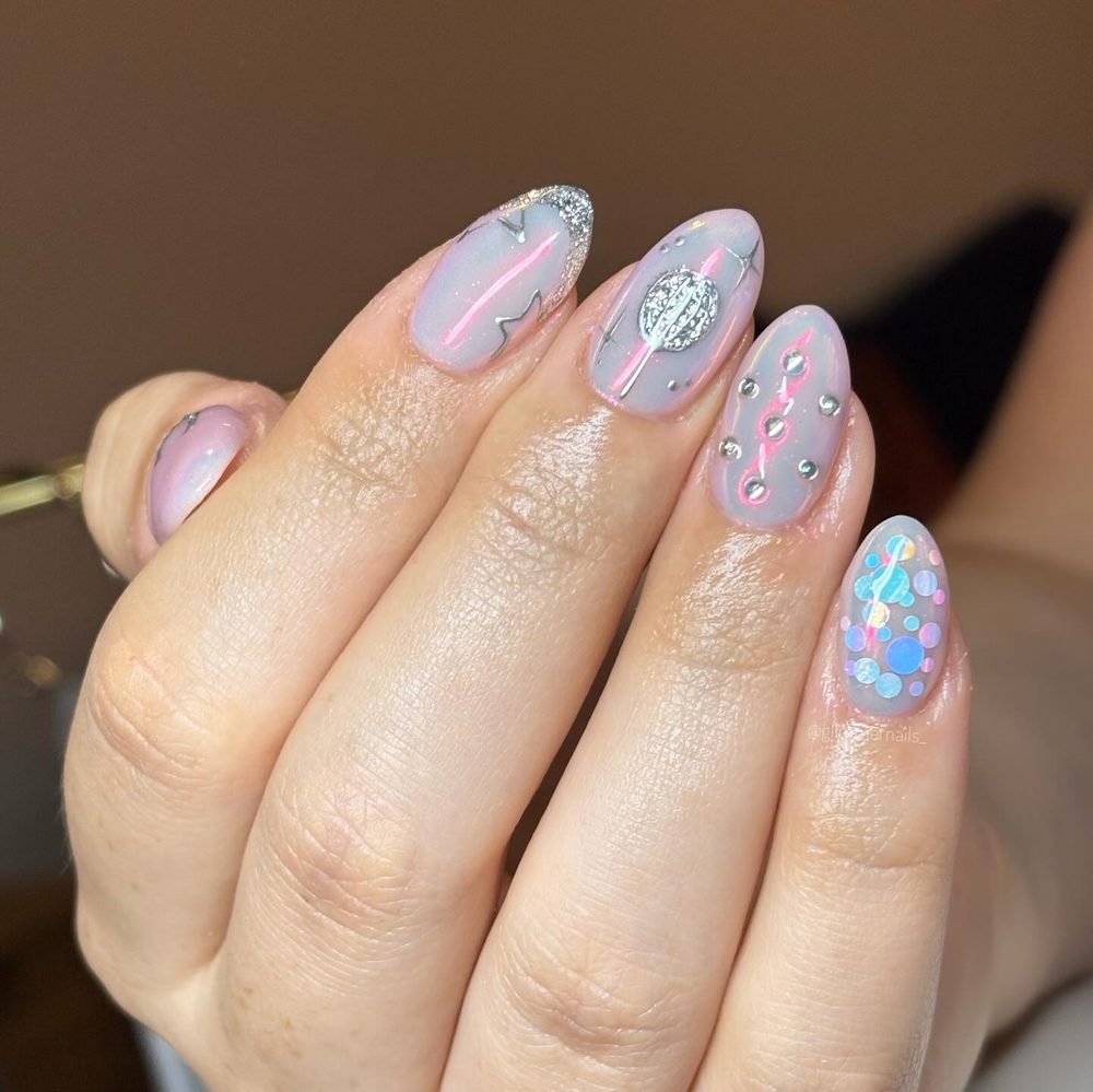 Soft pink nails with iridescent mosaic accents