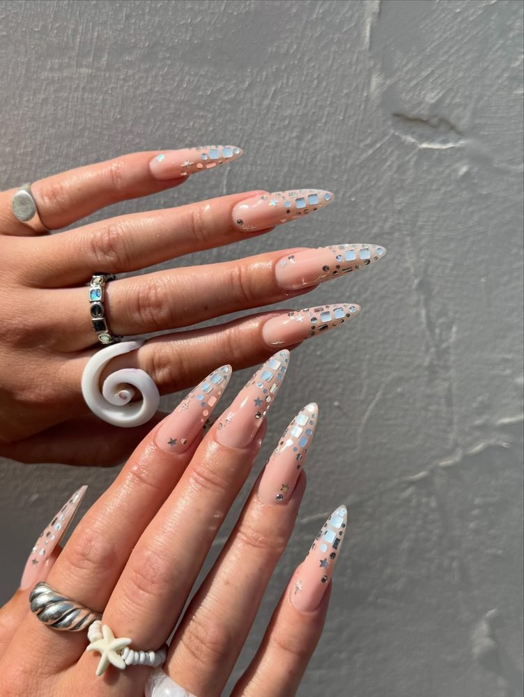 Long nude stiletto nails with reflective tips