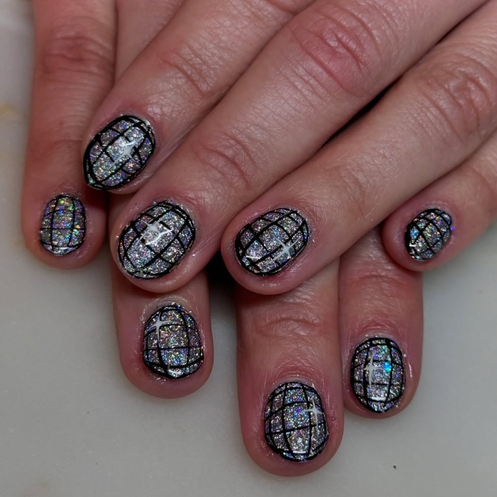 Black glitter nails with silver grid lines