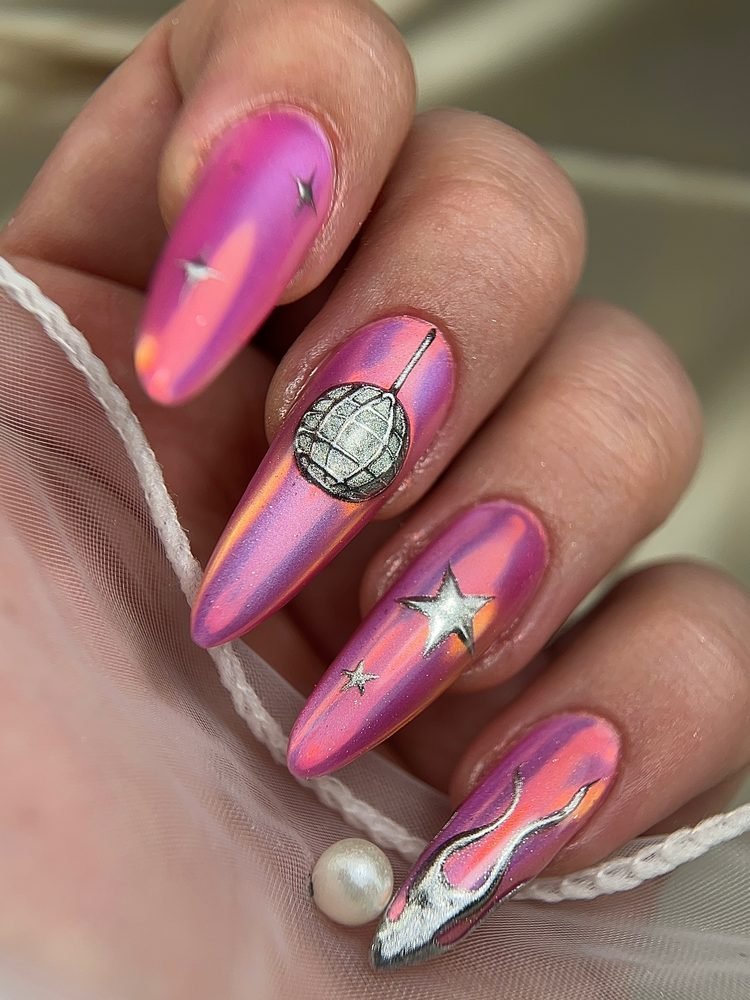 Pink chrome nails with disco ball accent