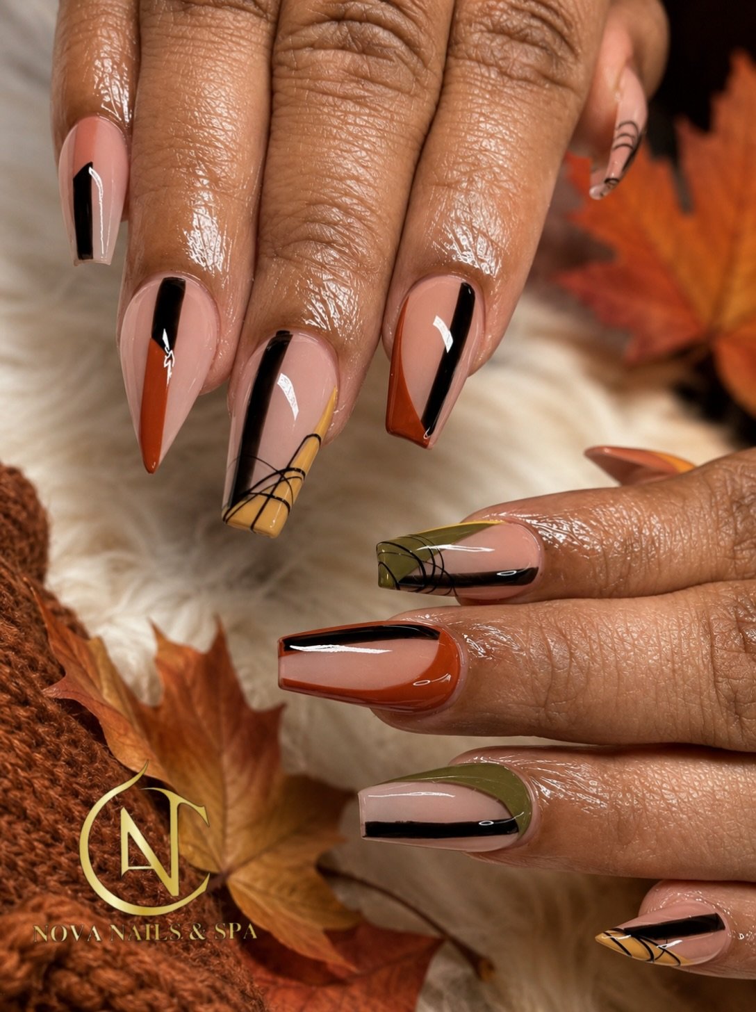 Neutral Stiletto Nails with Brown and Black Linework