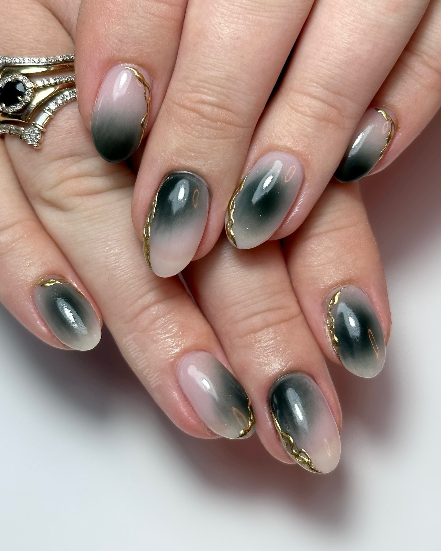 Smoky Emerald Aura Almond Nails