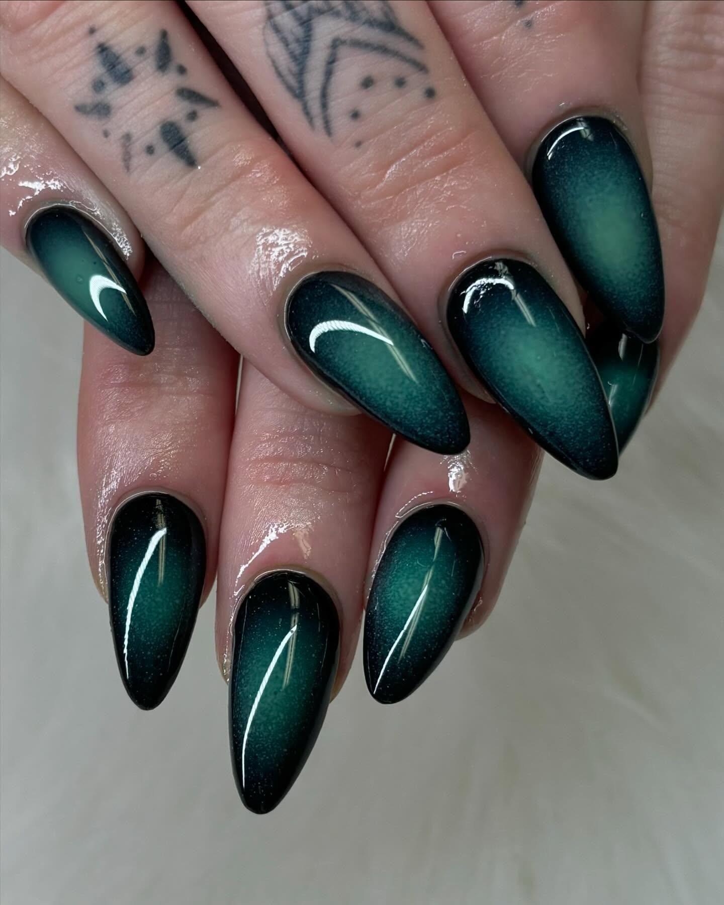 Dark Emerald Almond Nails with Curved White Accents