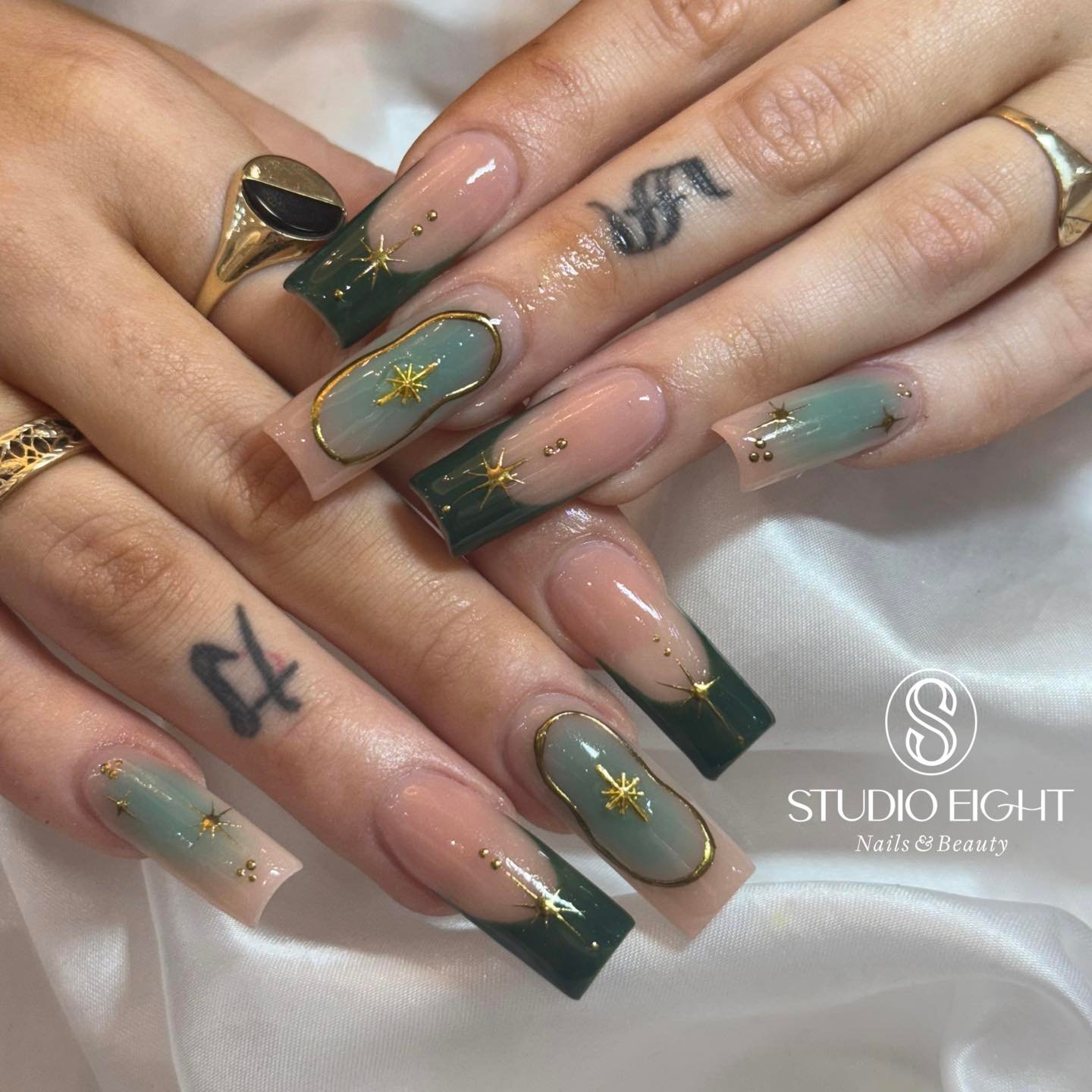 Sheer Nude Nails with Emerald Green Leaf-Like Tips