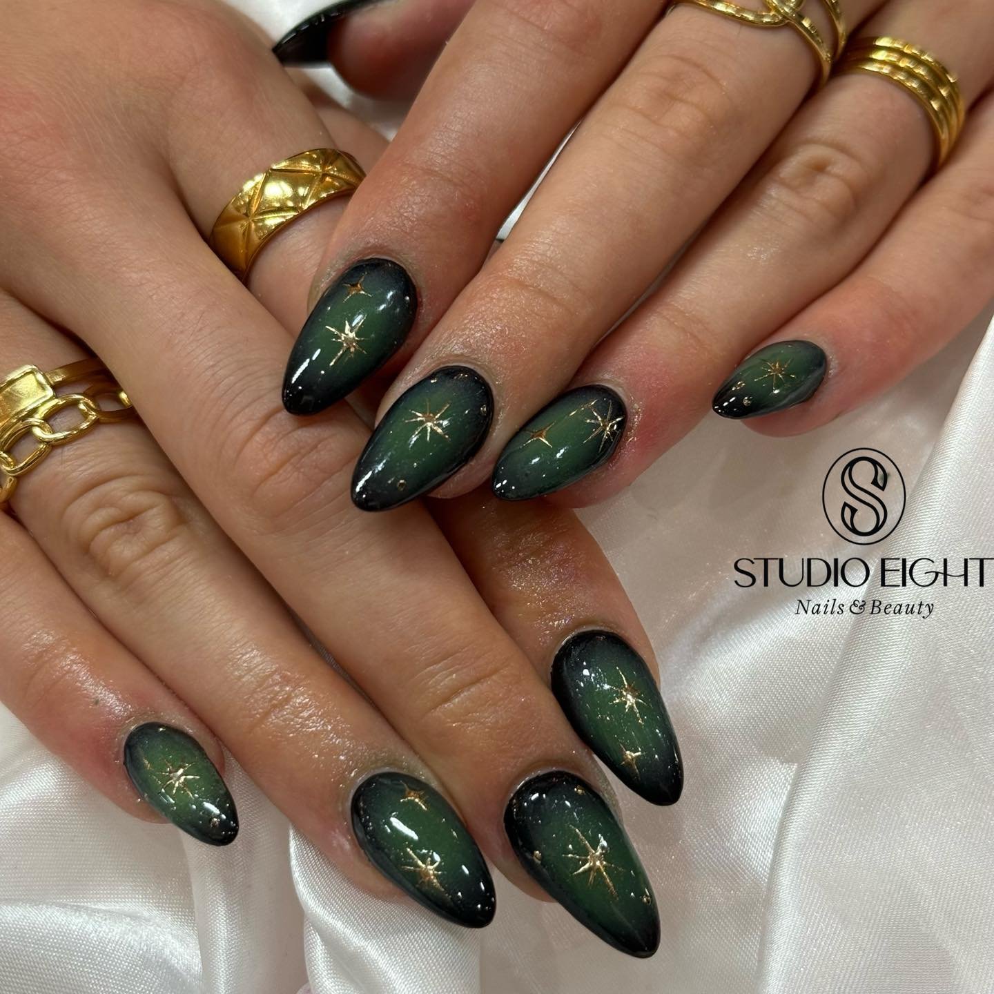 Deep Green Almond Nails with Fine Shimmer