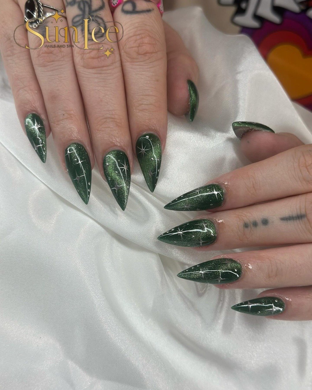 Emerald Green Pointed French Nails with Silver Accents