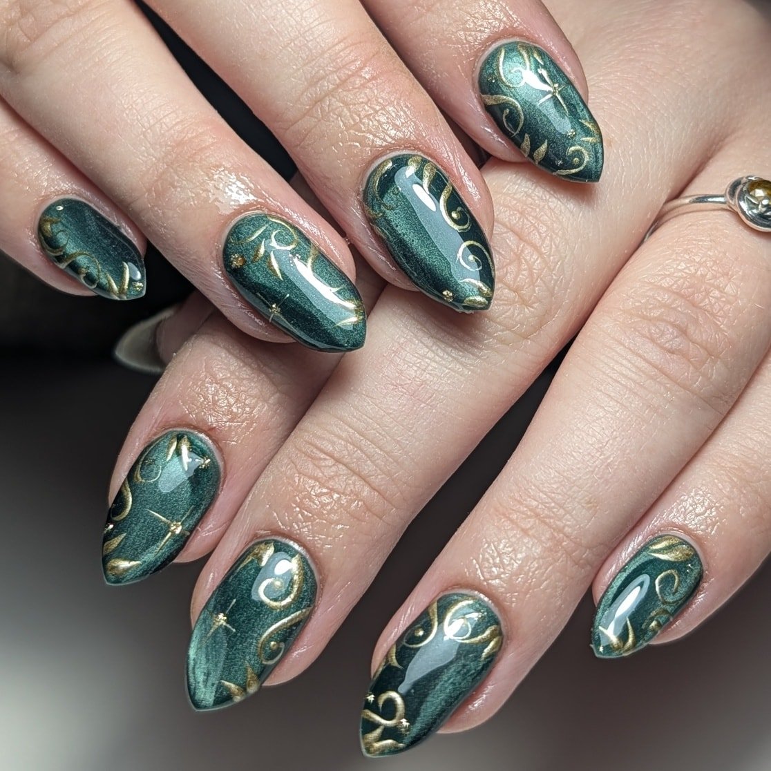 Emerald Green Almond Nails with Raised Silver Details
