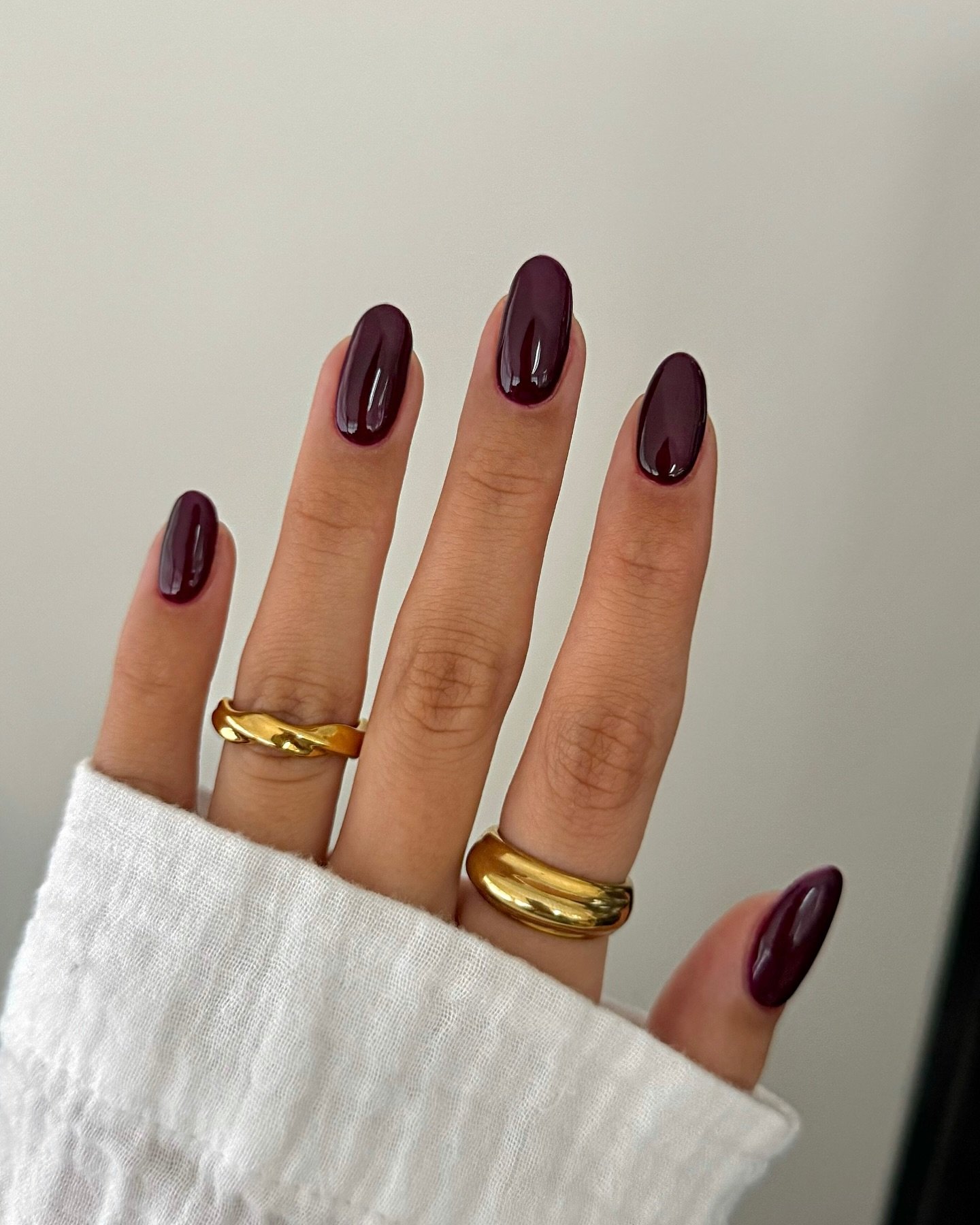 Glossy Deep Plum Almond Nails
