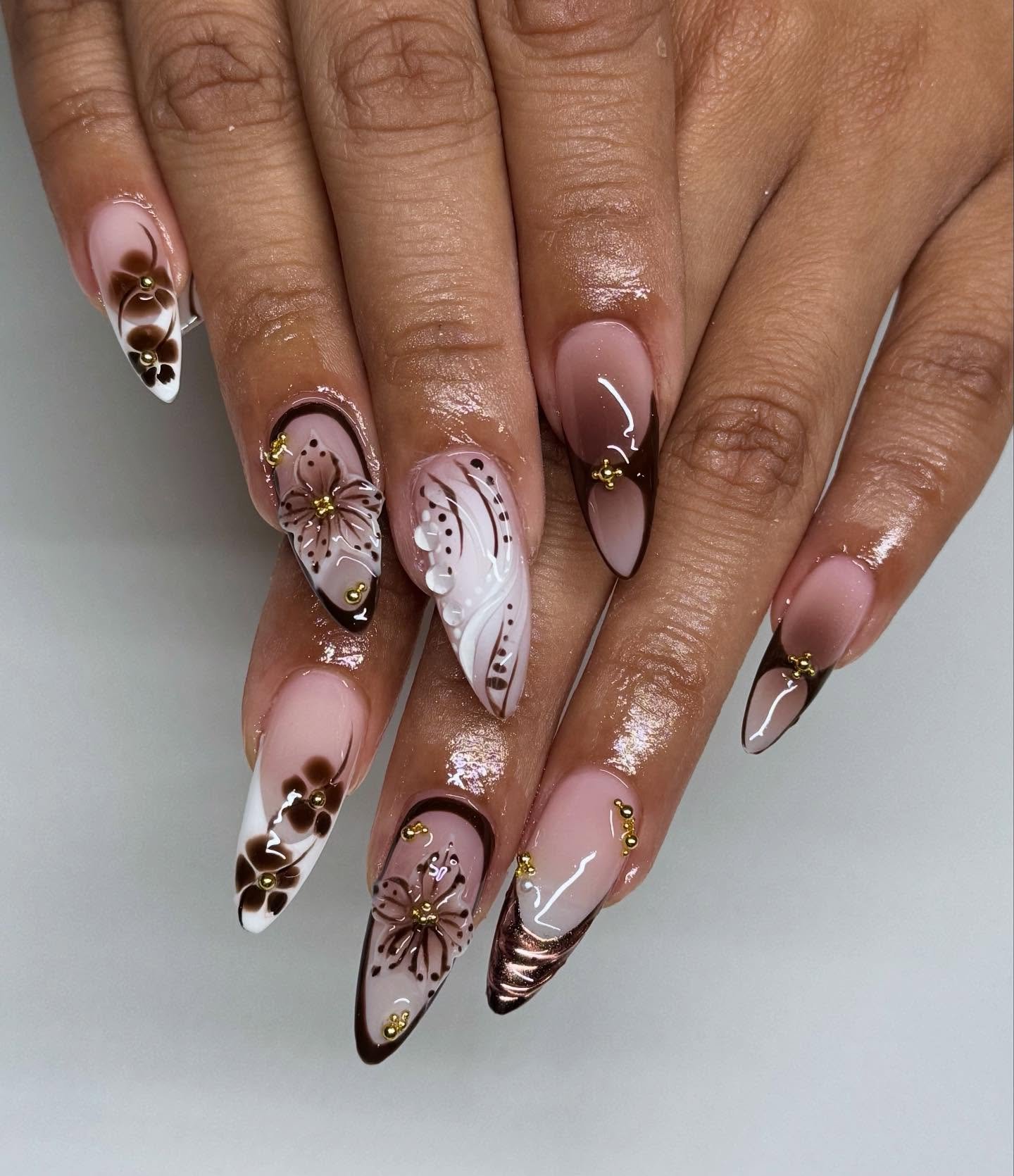 Neutral Almond Nails with Florals and Fine Gold Details