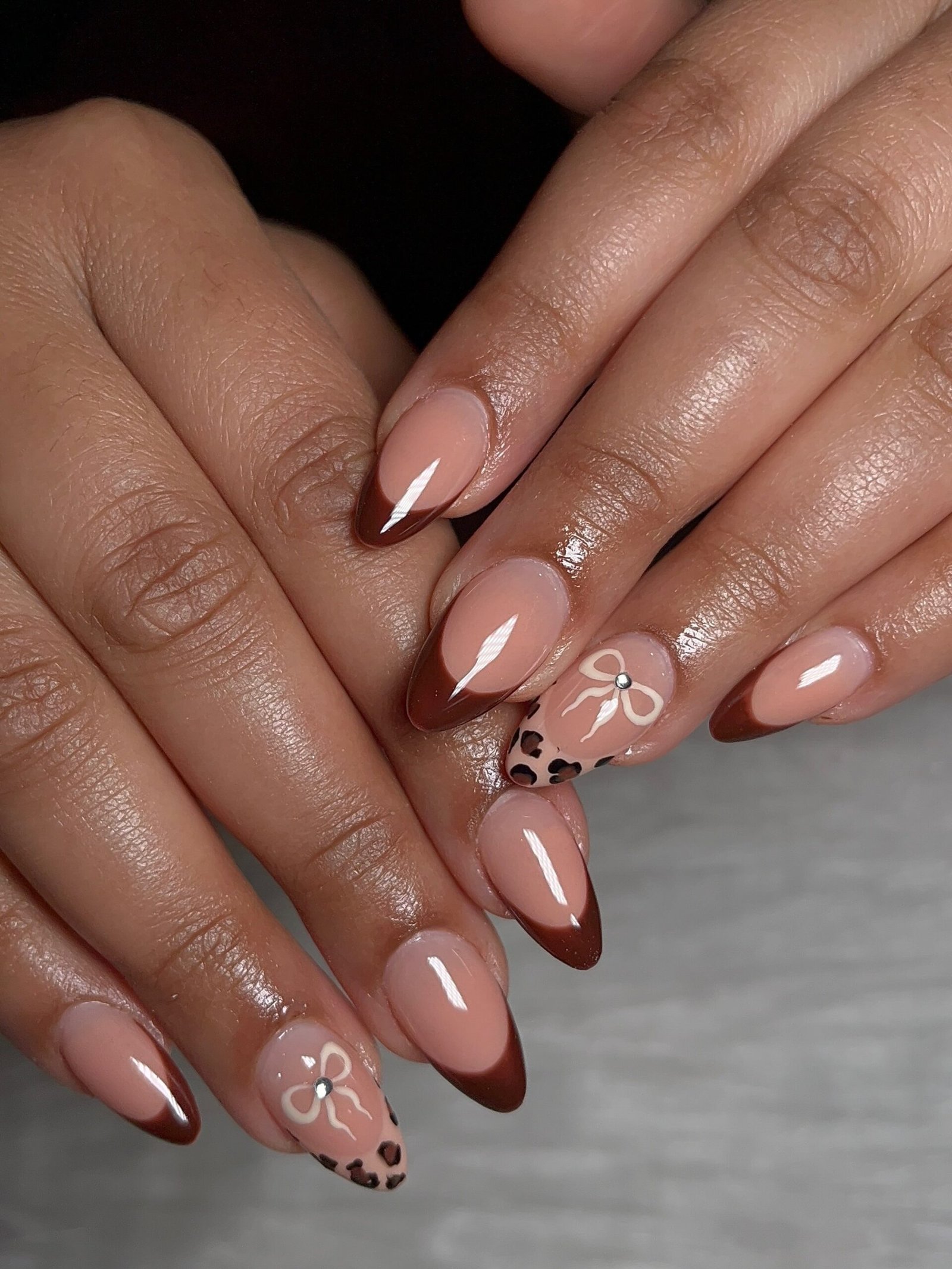 Blush Almond Nails with Delicate White Bow Details