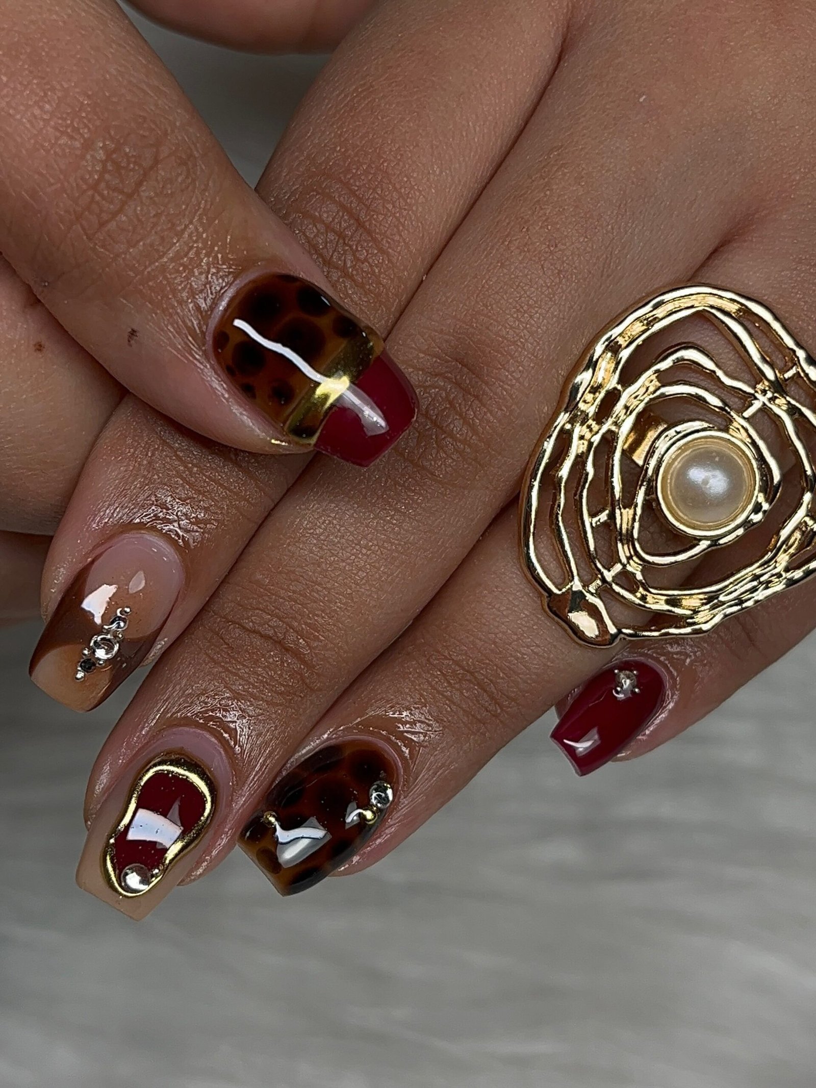 Brown and Burgundy Nails with Gold Metallic Accents
