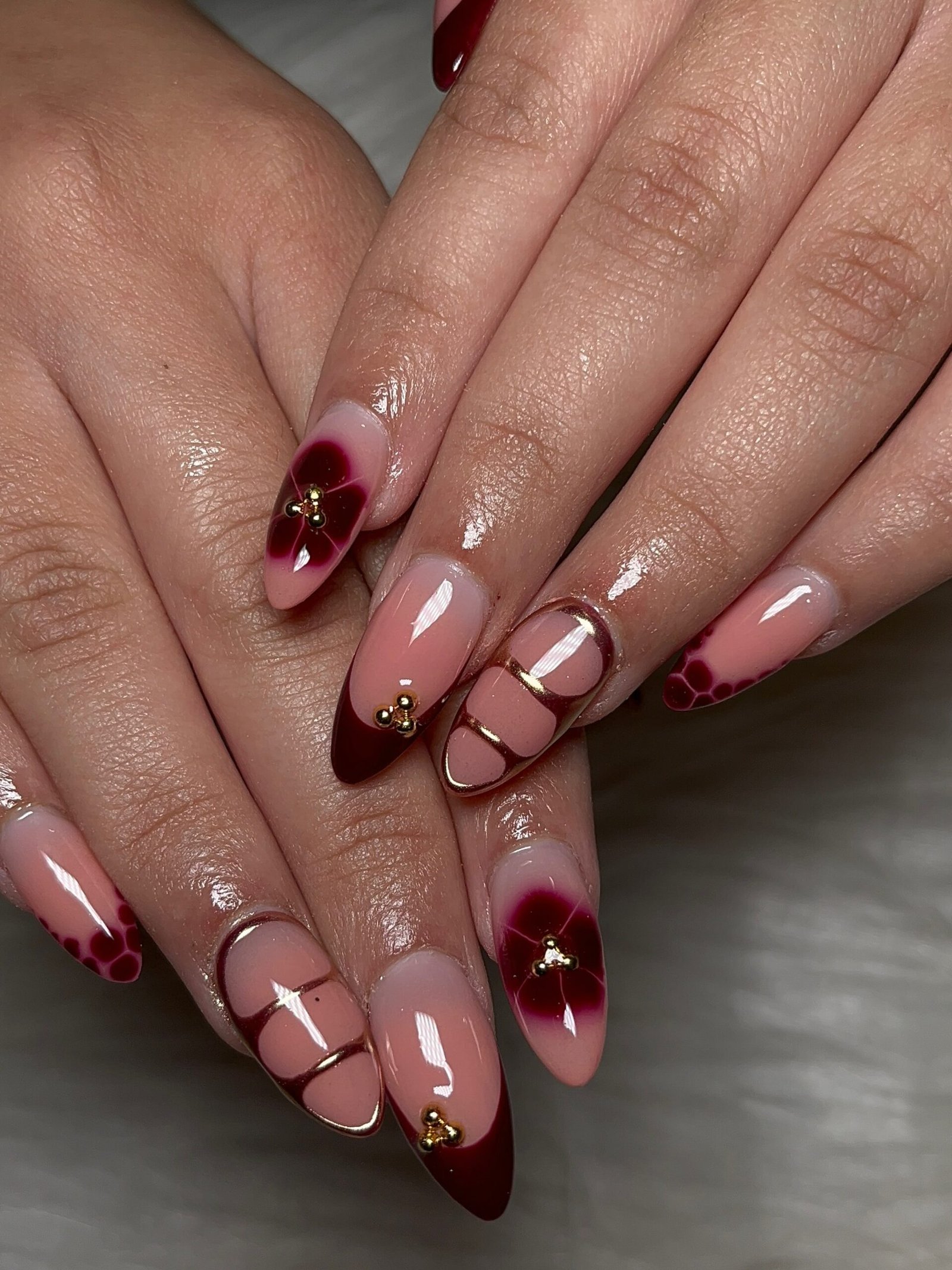 Blush and Burgundy Nails with Curved Line Details