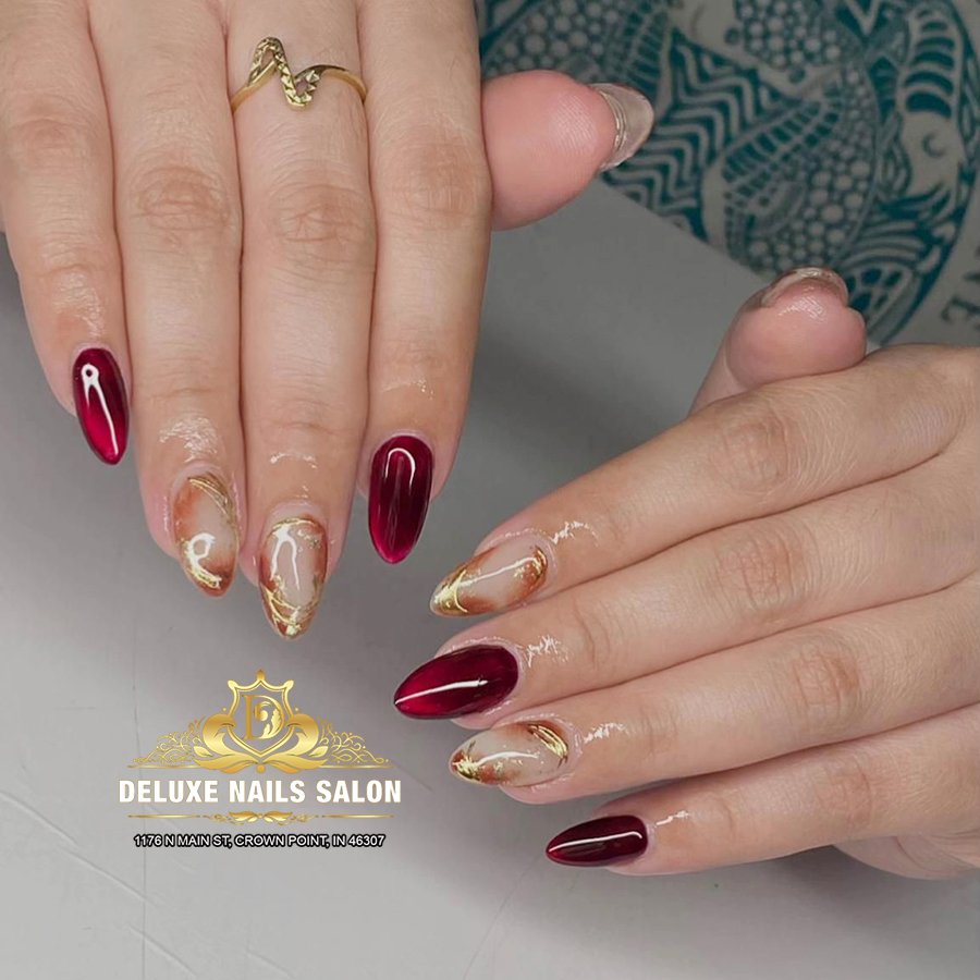 Deep Burgundy Nails with Gold Leaf and Embellished Accents