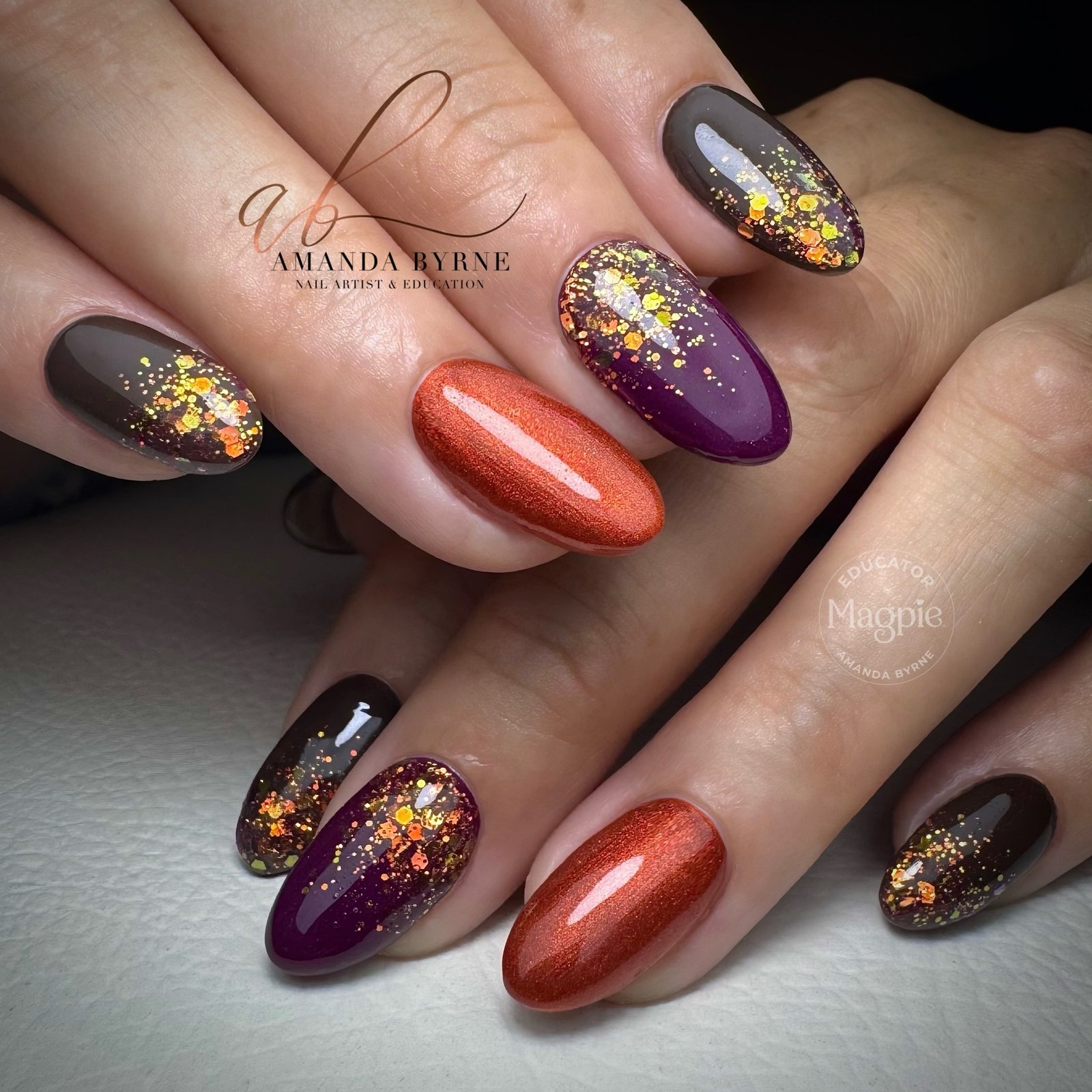 Black, Purple and Burnt Orange Nails with Glitter Details