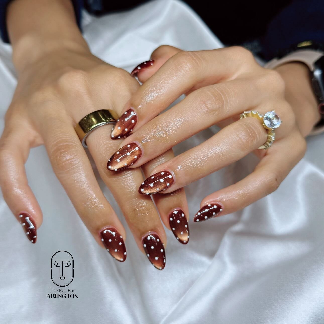 Brown and Burgundy Nails with Gold Glitter Accents