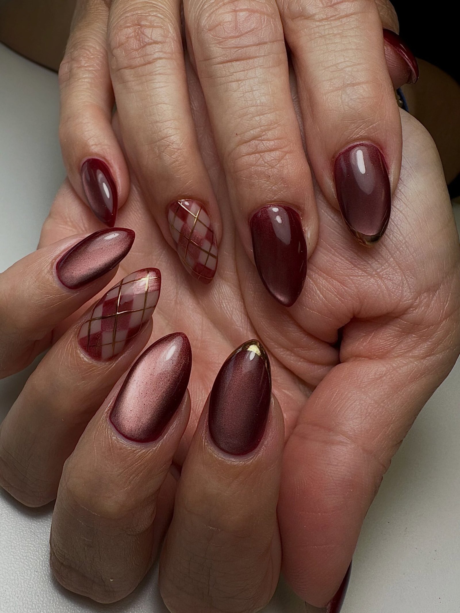 Glossy Burgundy Nails with Nude Negative-Space Details