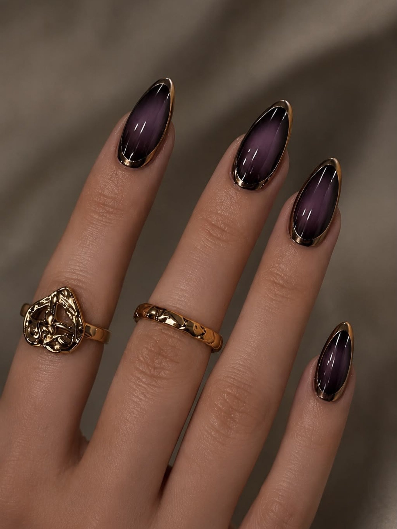 Deep Plum Almond Nails with Gold Jewelry Accents