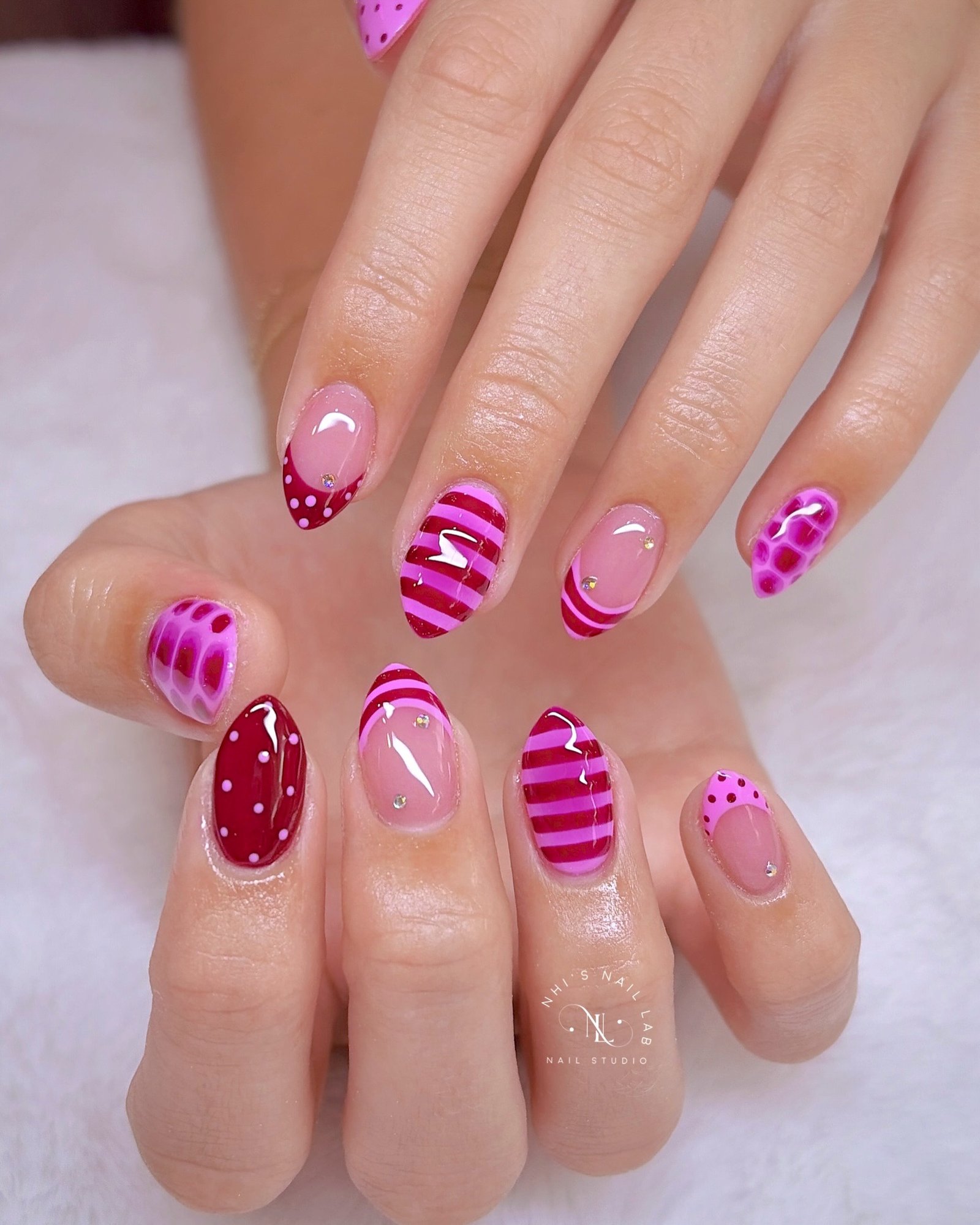 Pink Short Nails with Stripes and Textured Accents