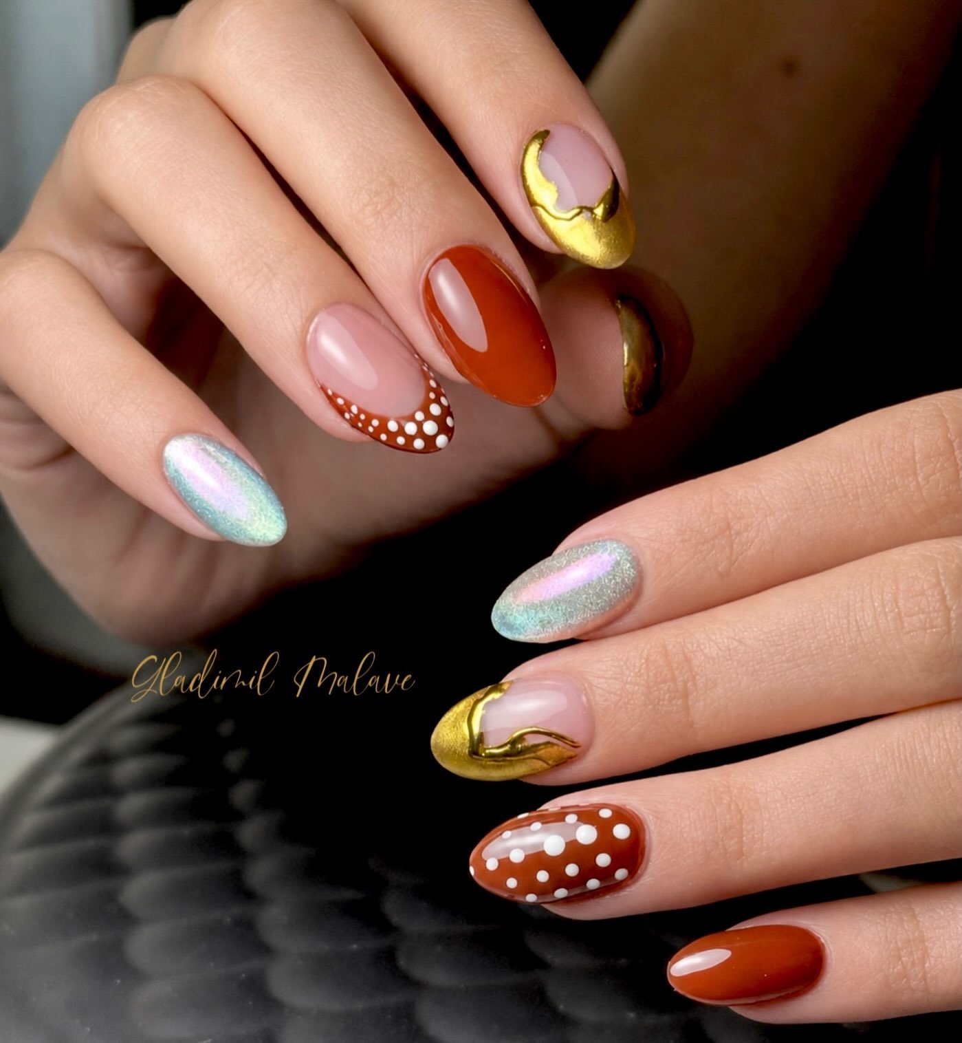 Neutral Almond Nails with Gold, Orange and Red Accents