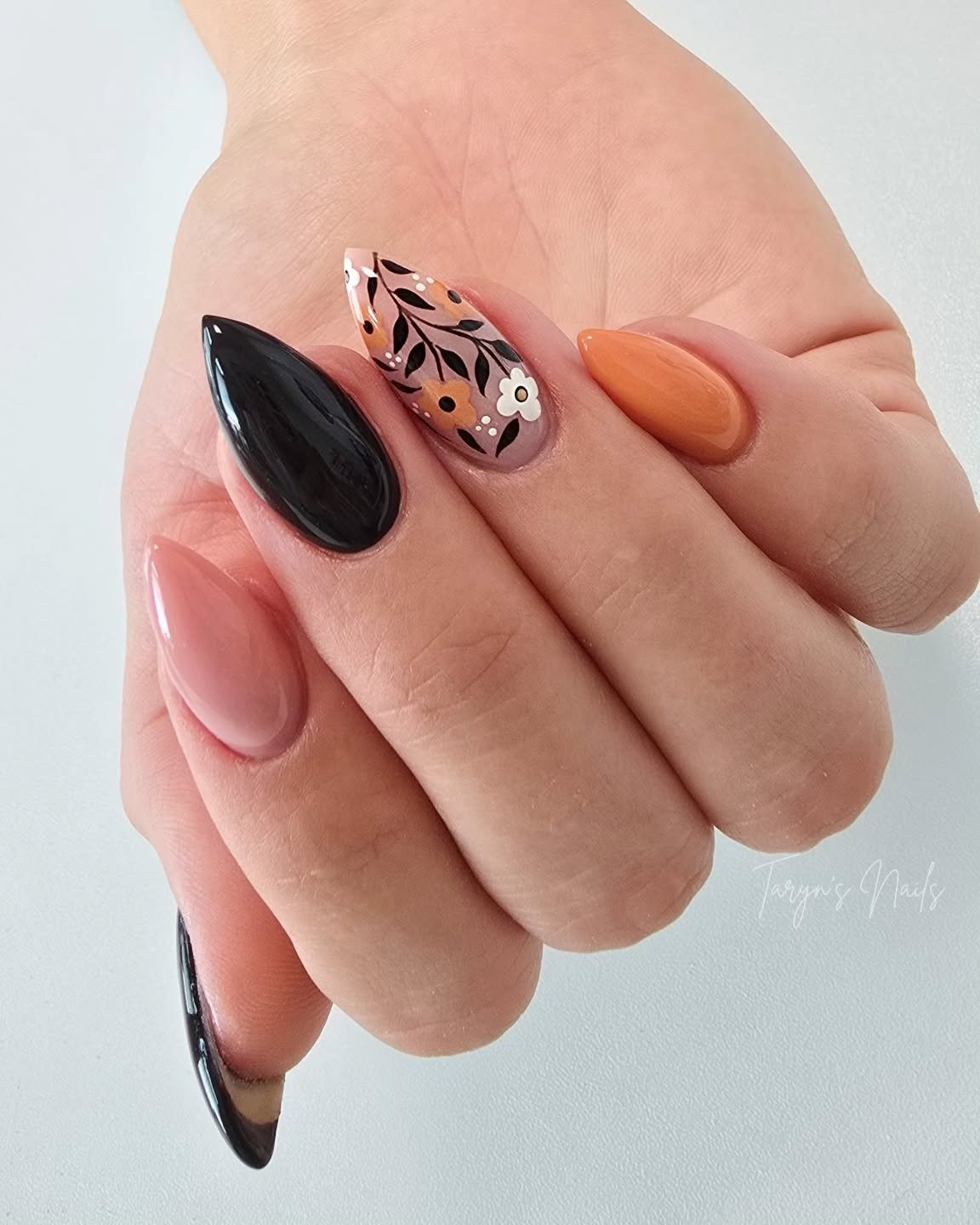 Glossy Black, Nude and Orange Almond Nails