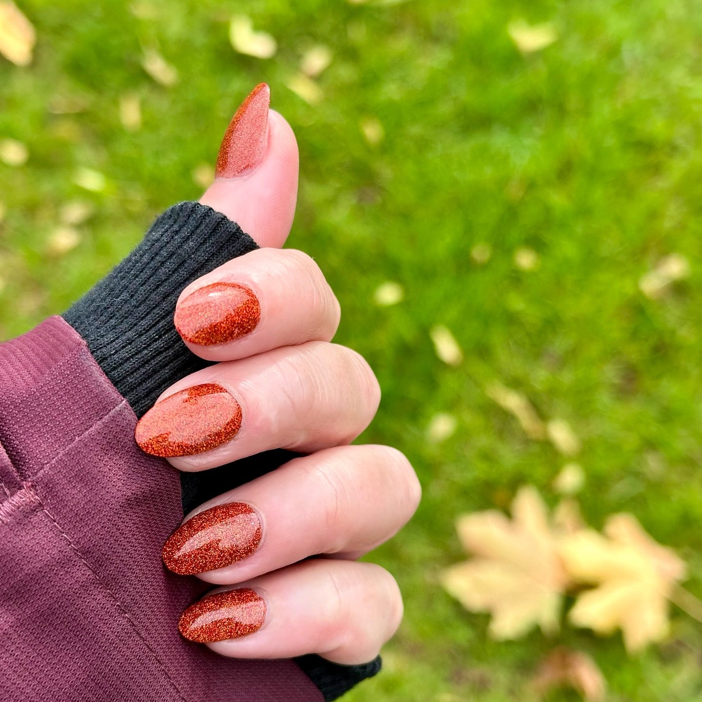 Short Orange Fall Nails with a Textured Accent