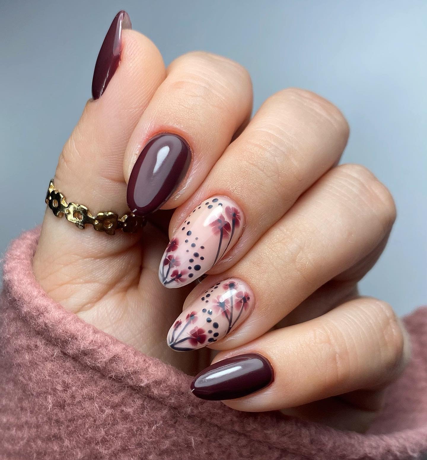 Plum and Cream Almond Nails with Speckled Accents